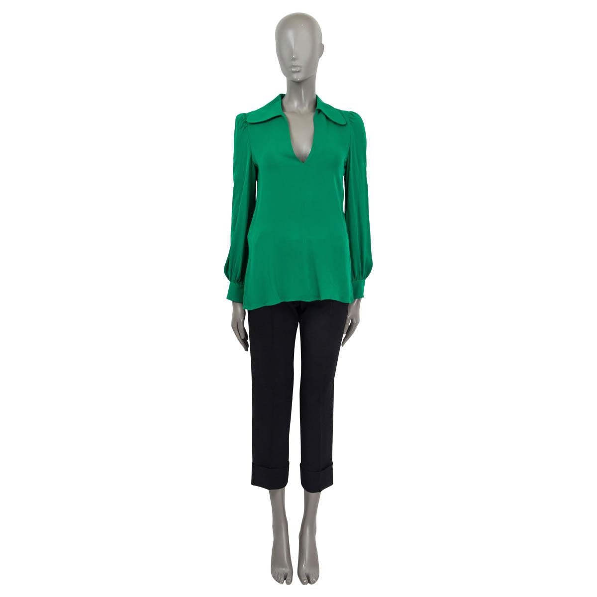 100% authentic Valentino Spring/Summer 2022 long sleeve blouse in green silk (100%). Features a spread collar, buttoned cuffs and a deep v-neck. Opens with a concealed zipper at the side. Unlined. Has been worn once or twice and is in excellent