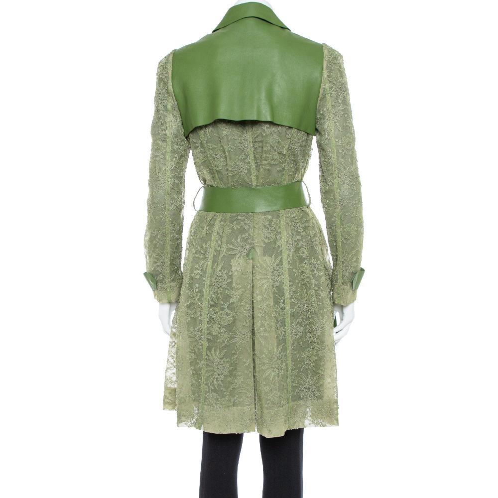 This creation from Valentino is beauty tailored into a trench coat. It brings a charming green on a design that is modern. The appeal of the creation lies both in its construction process and end result. Leather is fused with sheer lace to form the