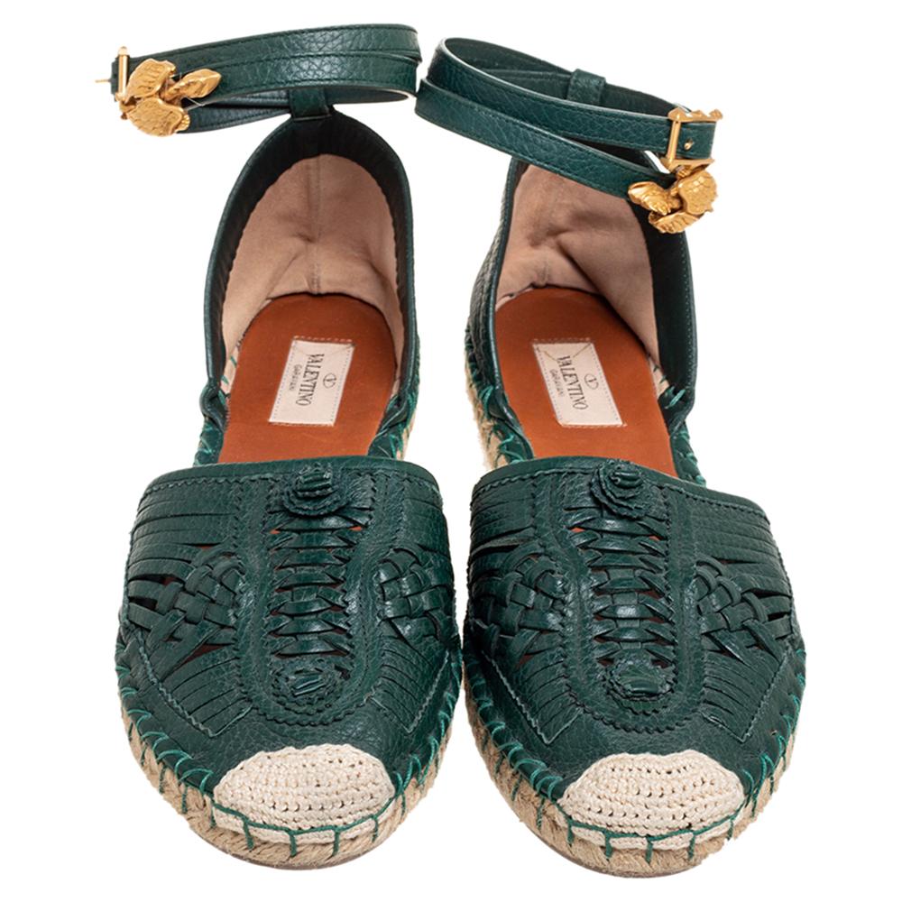 The house of Valentino presents to you these gorgeous green espadrilles. Crafted from leather, they have a weaved design on the front, gold-tone hardware, and comfortable leather soles. Wear the unique flats with crop tops and shorts for that chic