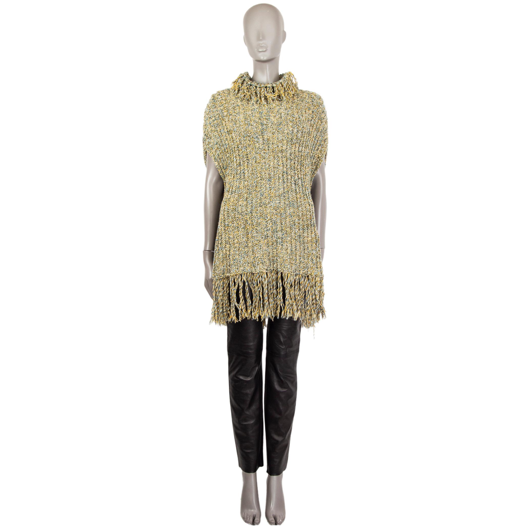 Valentino mock-neck sleeveless braid-knit sweater in light blue, yellos, sage, and black cotton (57%) and virgin wool (43). With fringed neck and hemline. Has been worn and is in excellent condition. 

Tag Size M
Size M
Bust 106cm (41.3in) to 160cm
