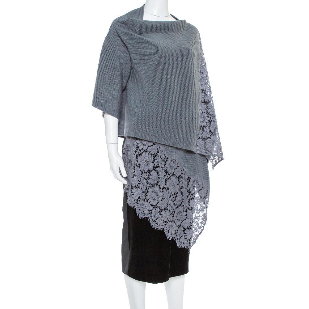 Who doesn't love creations that are both comfortable and stylish at the same time! Made from a silk and cotton blend, the cardigan features dainty lace trims on the edges and a wrap-around style. Wear it with a pencil skirt and strappy heels for a