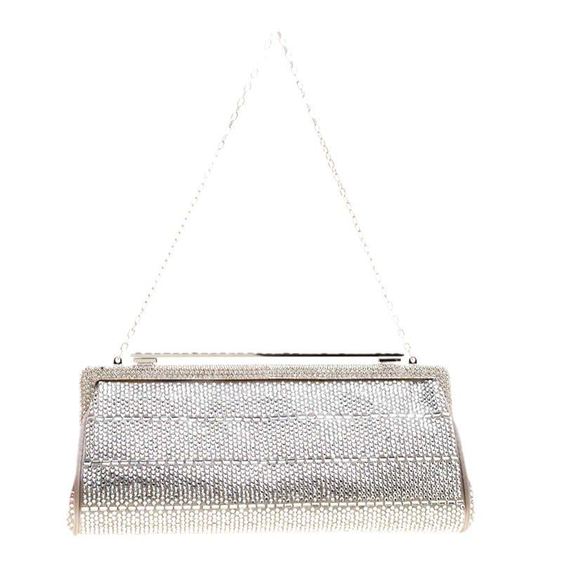 Perfect to add some shine and bling even to the simplest of your party looks, this stunning Valentino evening clutch will stand out and catch the eye. Crafted in grey satin, this clutch is entirely covered in crystal embellishments with a crystal