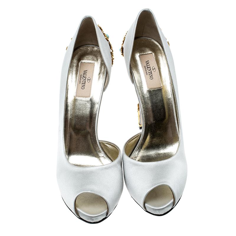 Made by Valentino, these are the ideal mix of comfort and style. Feel great as you waltz away in this satin pair. They have been designed in a D'orsay cut with peep toes and magnificent jewels and gold detailing extending from the counters to the 13