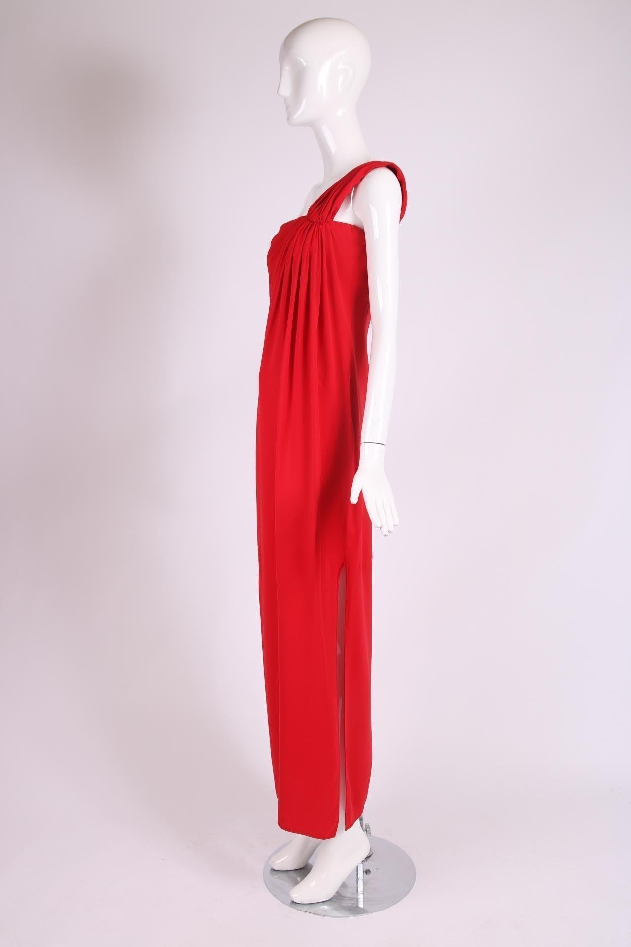 Valentino haute couture red silk single shoulder column gown with high side slit. Features an interior corset with boning which fastens at the side via hook and eye closures with a hidden side seam zipper on top. In very good condition with a small