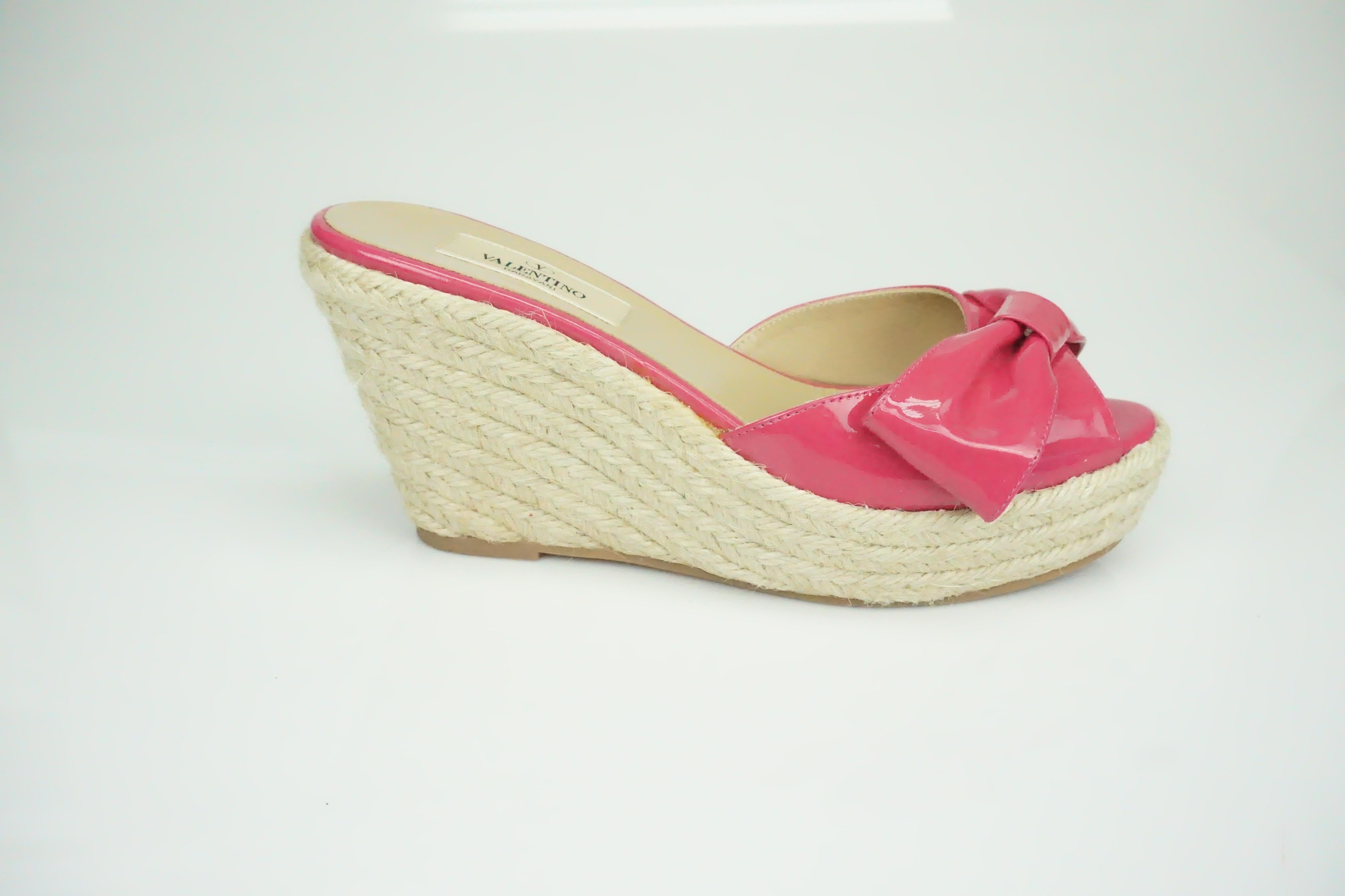 Valentino Hot Pink Patent Espadrille Wedges w/ Bow Detail - 36  These beautiful wedges are in good condition. There is very little wear to them besides the bottom of the shoe. There is no scuffing and no stains. The shoe has a peep toe and has a
