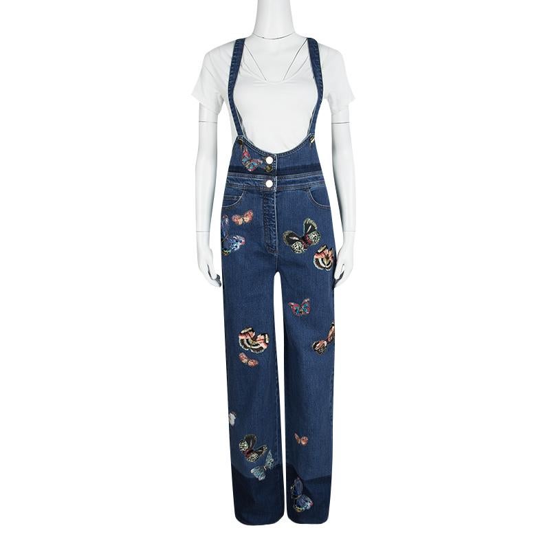 Valentino brings forth the latest trends of the season is a chic design with this denim over-all that are perfect for your casual wardrobe. Showcasing cute butterflies that are embroidered on its surface for a refreshing an colorful look, these