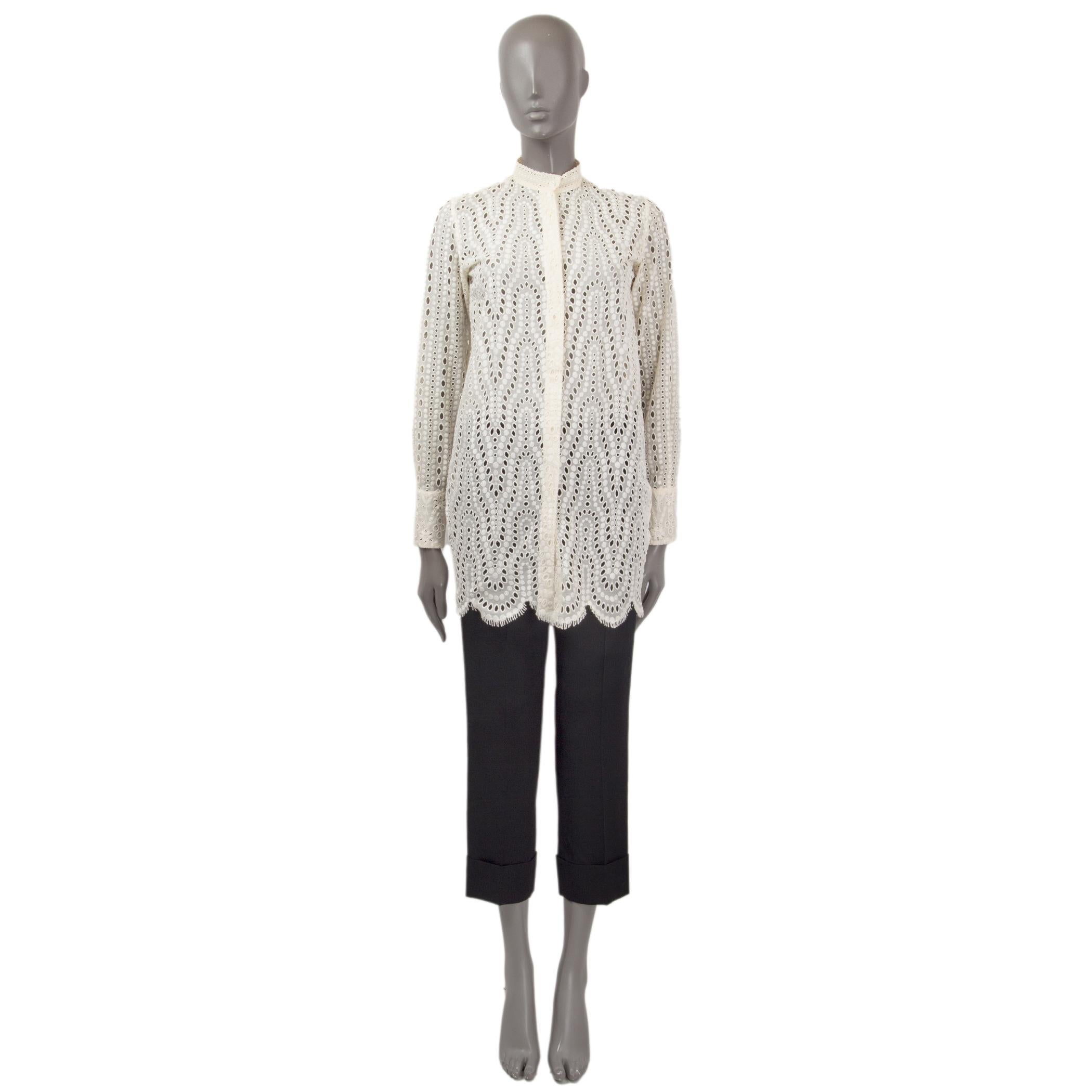 100% authentic Valentino broderie anglaise shirt in ivory cotton (93%) and polyester (7%). Features long sleeves, buttoned cuffs and a high neck. Opens with buttons on the front. Unlined. Has been worn and is in excellent