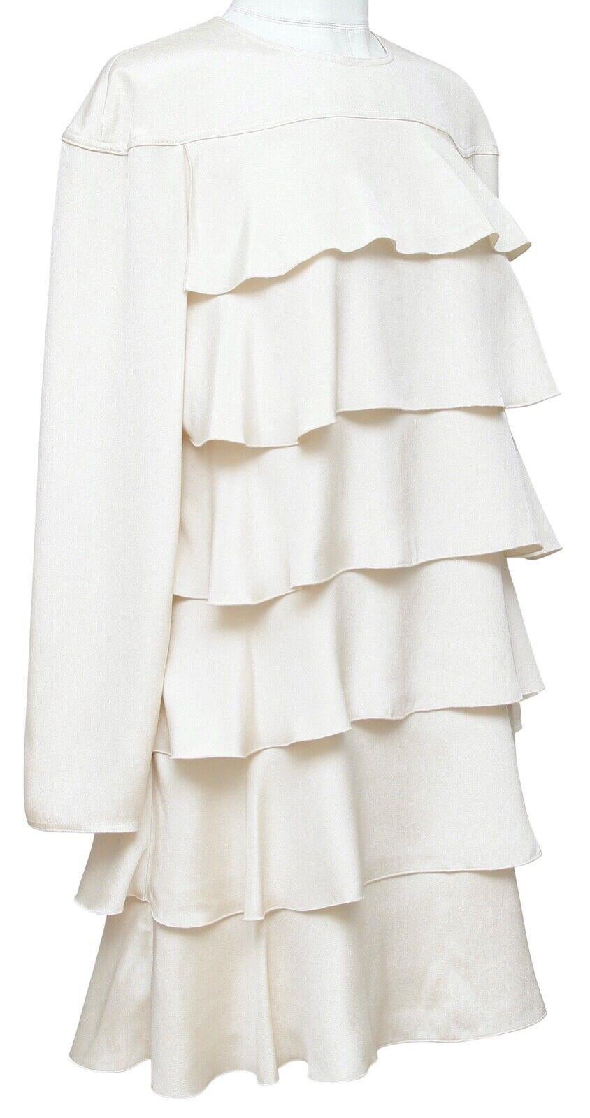 GUARANTEED AUTHENTIC VALENTINO LONG SLEEVE SILK DRESS

 Details:
 • Ivory silk dress.
 • Long sleeve.
 • Crew neck.
 • Tiered design.
 • Rear covered lower zipper closure with open top area and button at back neckline.
 • Lined.

 Fabric: 100%