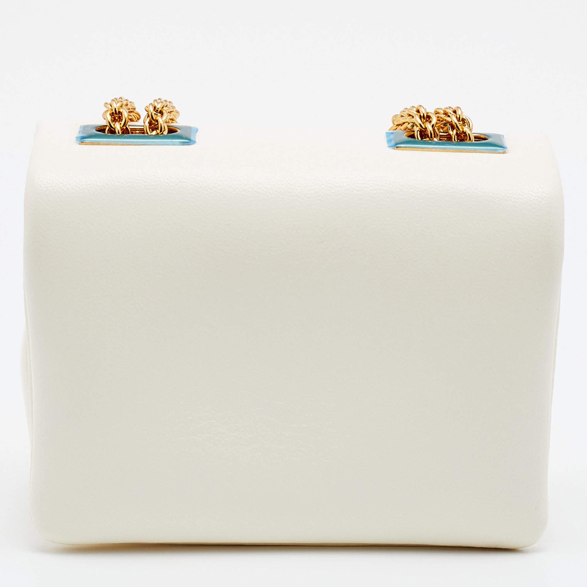 If you're a fan of teeny-tiny bags, this Valentino micro bag is for you. It is fashioned in ivory leather and punctuated by a single pyramid stud.

Includes: Original Dustbag, Original Box, Info Booklet, Brand Tag

