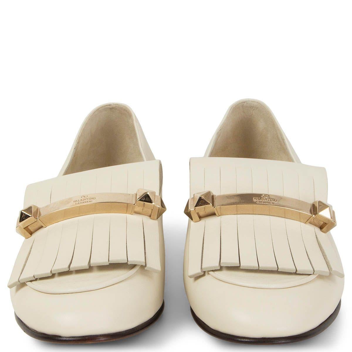 100% authentic Valentino Uptown embellished fringed ivory leather loafers featuring light gold-tone hardware and a stacked heel. Brand new. Come with dust bag.

Measurements
Imprinted Size	39.5
Shoe Size	39.5
Inside Sole	26.5cm (10.3in)
Width	7.5cm