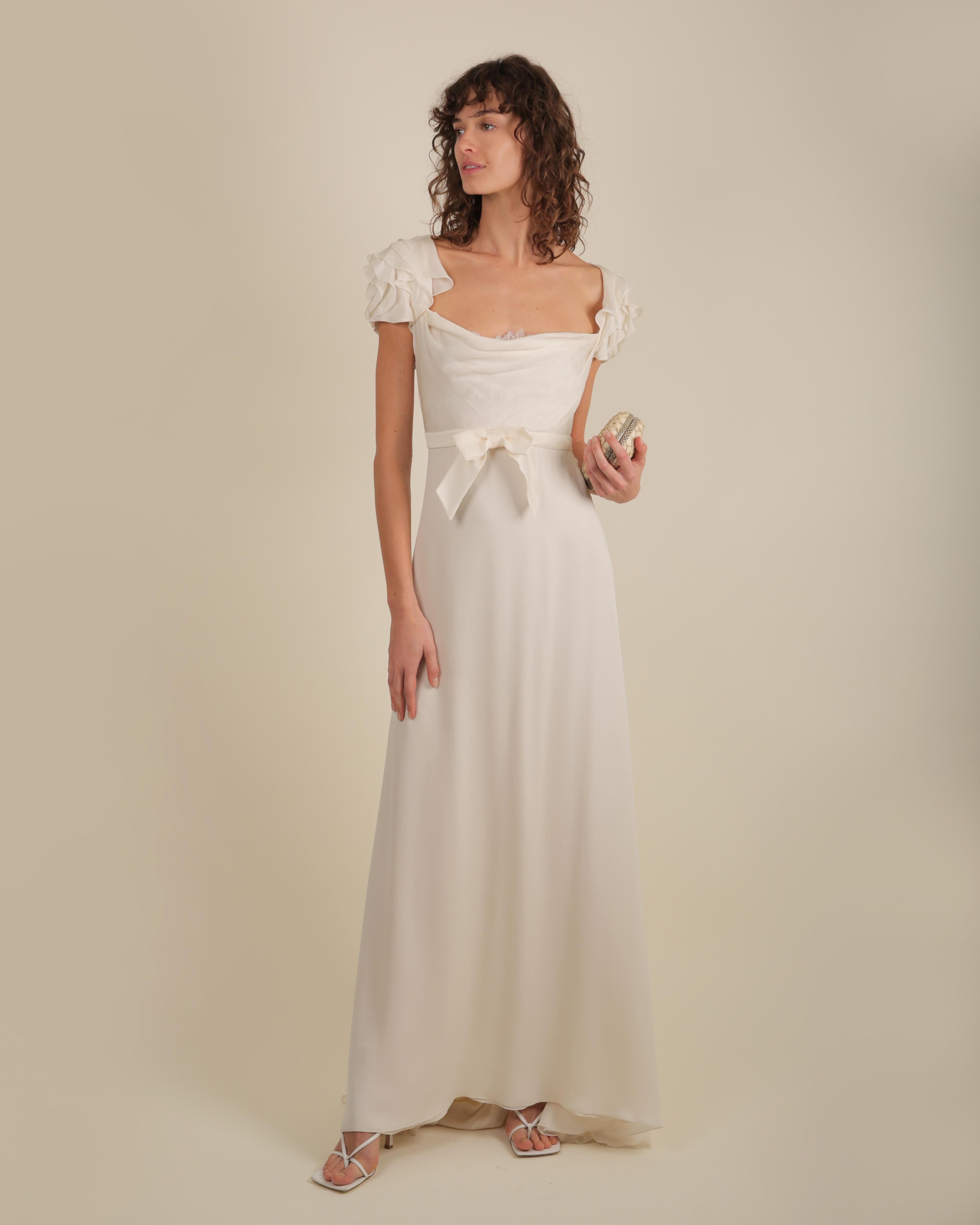 LOVE LALI Vintage

This is a beautiful ivory gown by Valentino that could be worn in an evening or just as easily as a wedding dress
The bust has an inner panel of white peekaboo lace - the neckline is slightly draped so that it slightly