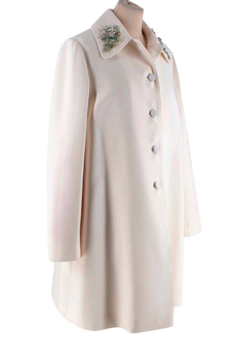 Valentino Ivory Wool Twill Crystal Embellished Collar Dress Coat
 

 - Elegant lightweight wool twill dress coat with a gentle A-line silhouette and gently rounded point collar
 - Stunning crystal and pale green beadwork set on twisted wire for a
