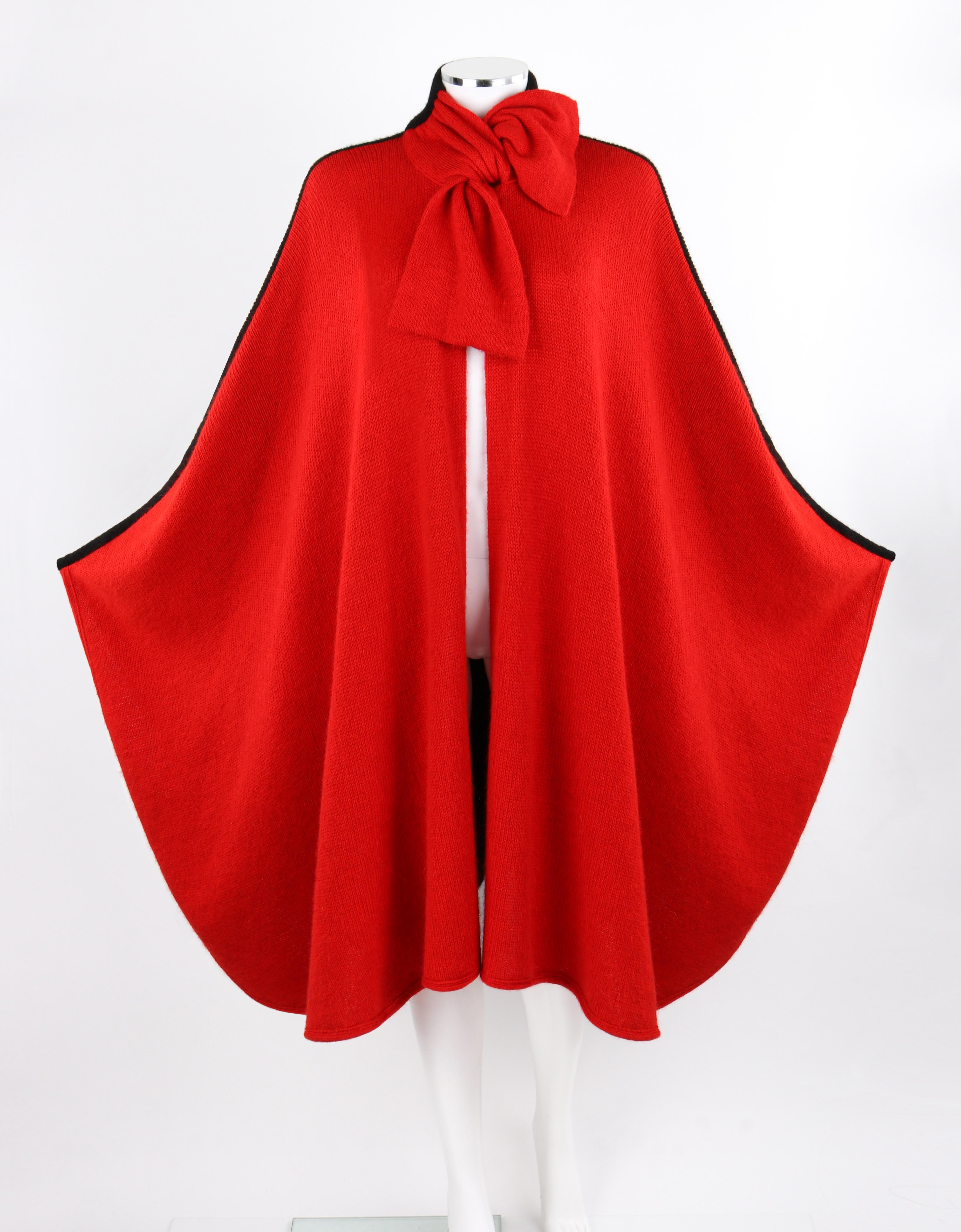 VALENTINO Knitwear c.1980's Red Black Alpaca Wool Knit Scarf Tie Button Cape VTG

Brand / Manufacturer: Valentino Knitwear
Circa: 1980's
Designer: Valentino Garavani
Style: Cape
Color(s): Red, Black
Lined: No
Marked Fabric: 