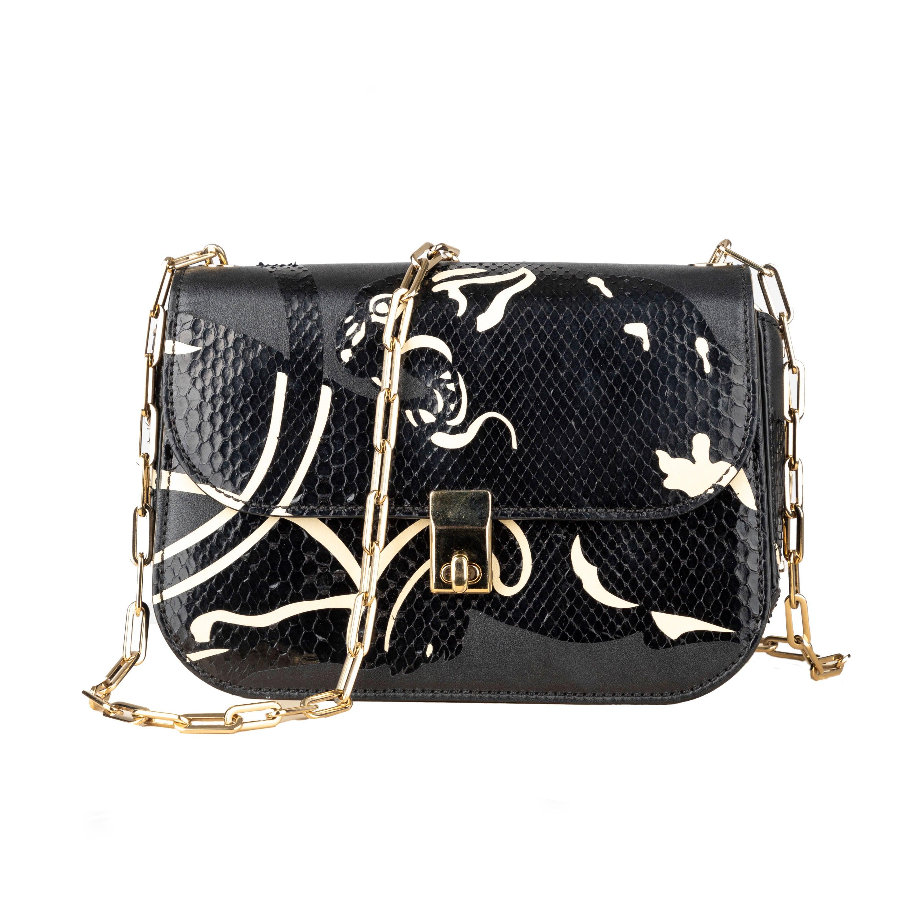 Expertly crafted from leather and snakeskin, the Valentino Panther Crossbody Bag exudes luxury and style. The sleek black design features a stunning panther print in black and cream, accented by a golden accents and polished gold-tone chain strap