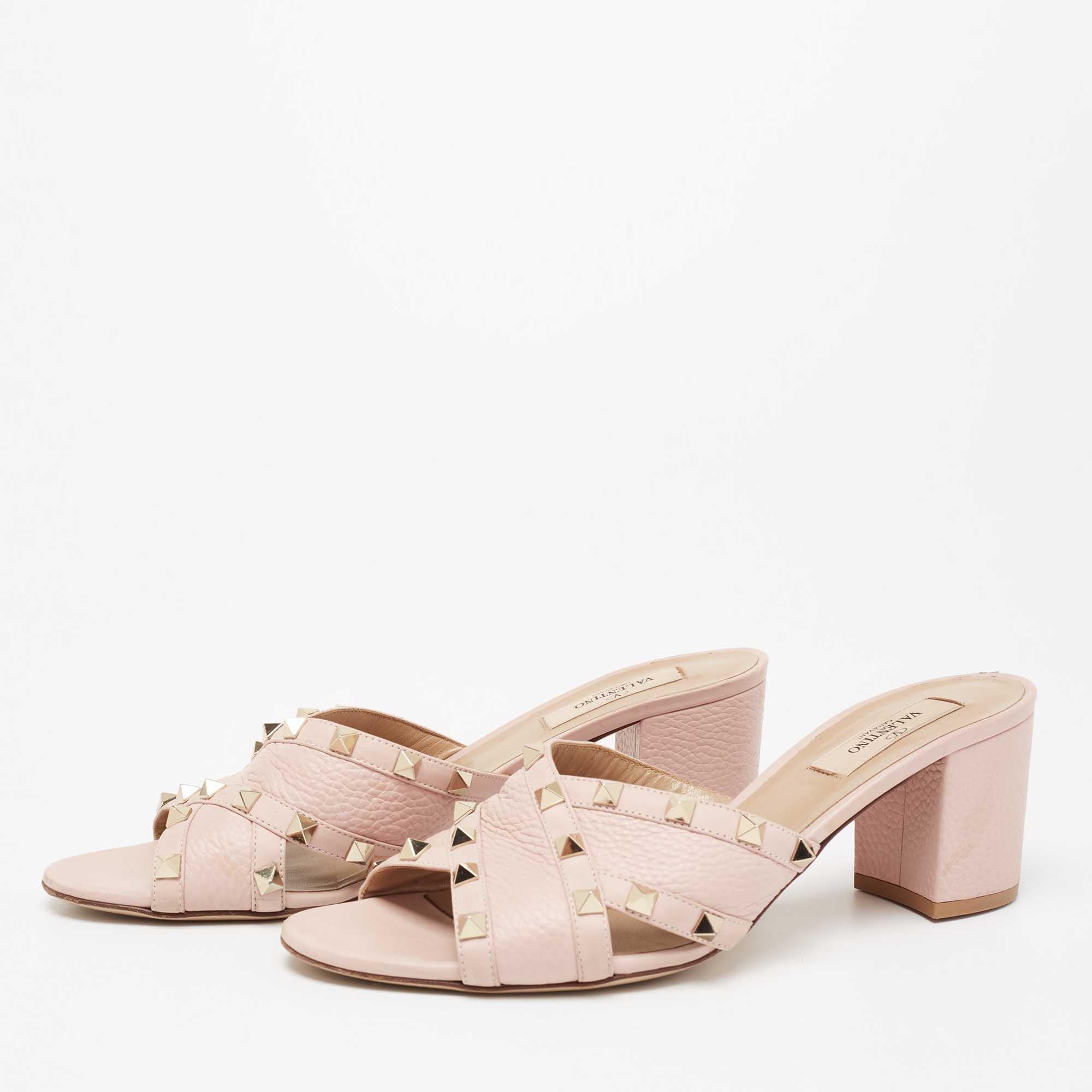When considering Valentino, three words come to mind: luxurious, bold, and iconic. These gorgeous slide sandals are crafted from leather, and the sleek silhouette is adorned with carefully placed Rockstuds. They can be styled with various outfits in