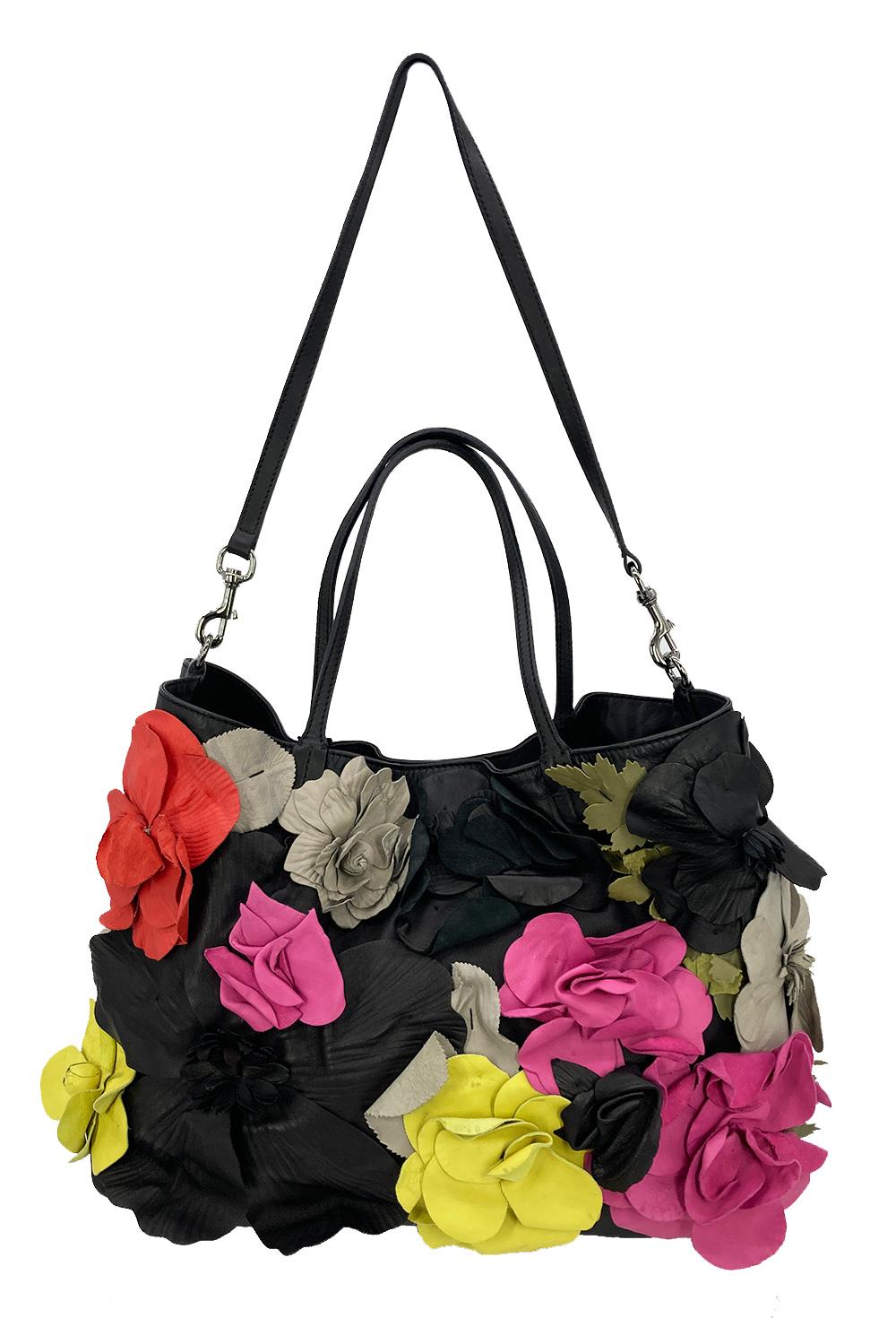Valentino Leather Floral Embellished Tote in excellent condition. Super soft black leather exterior trimmed with multi color leather floral embellishments along front side. Matching removable leather shoulder strap easily converts between tote and