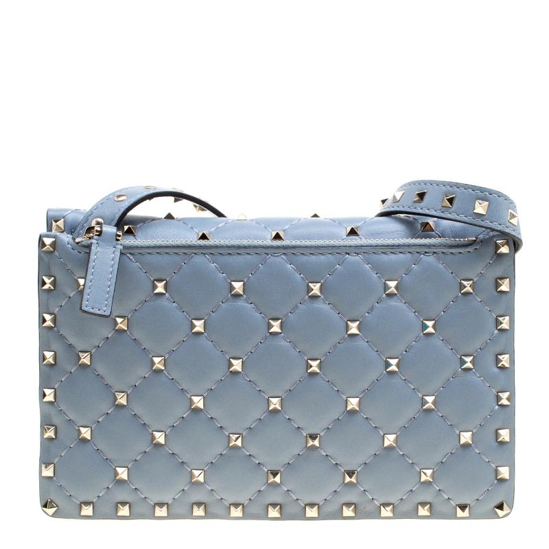 This chic and impressive crossbody bag by Valentino will surely meet all your expectations. Complement your attire by adorning this classic light blue creation. Crafted from leather, it features a quilted pattern with the signature gold-tone