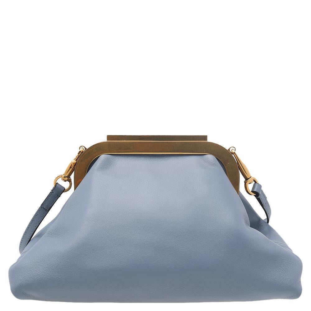Carved in a unique, slouchy silhouette, this Supervee clutch from the House of Valentino will surely offer your style with exceptional beauty and grace. It has been created using light-blue leather on the exterior and augmented with a large