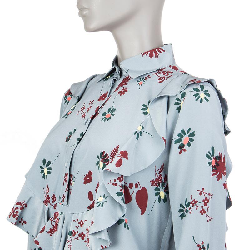 Valentino ruffled floral blouse in light blue, forest green, burgundy and vanilla silk (100%). Opens with buttons on the front. Unlined. Has been worn and is in excellent condition. See separate listing for matching pants.

Tag Size 40
Size