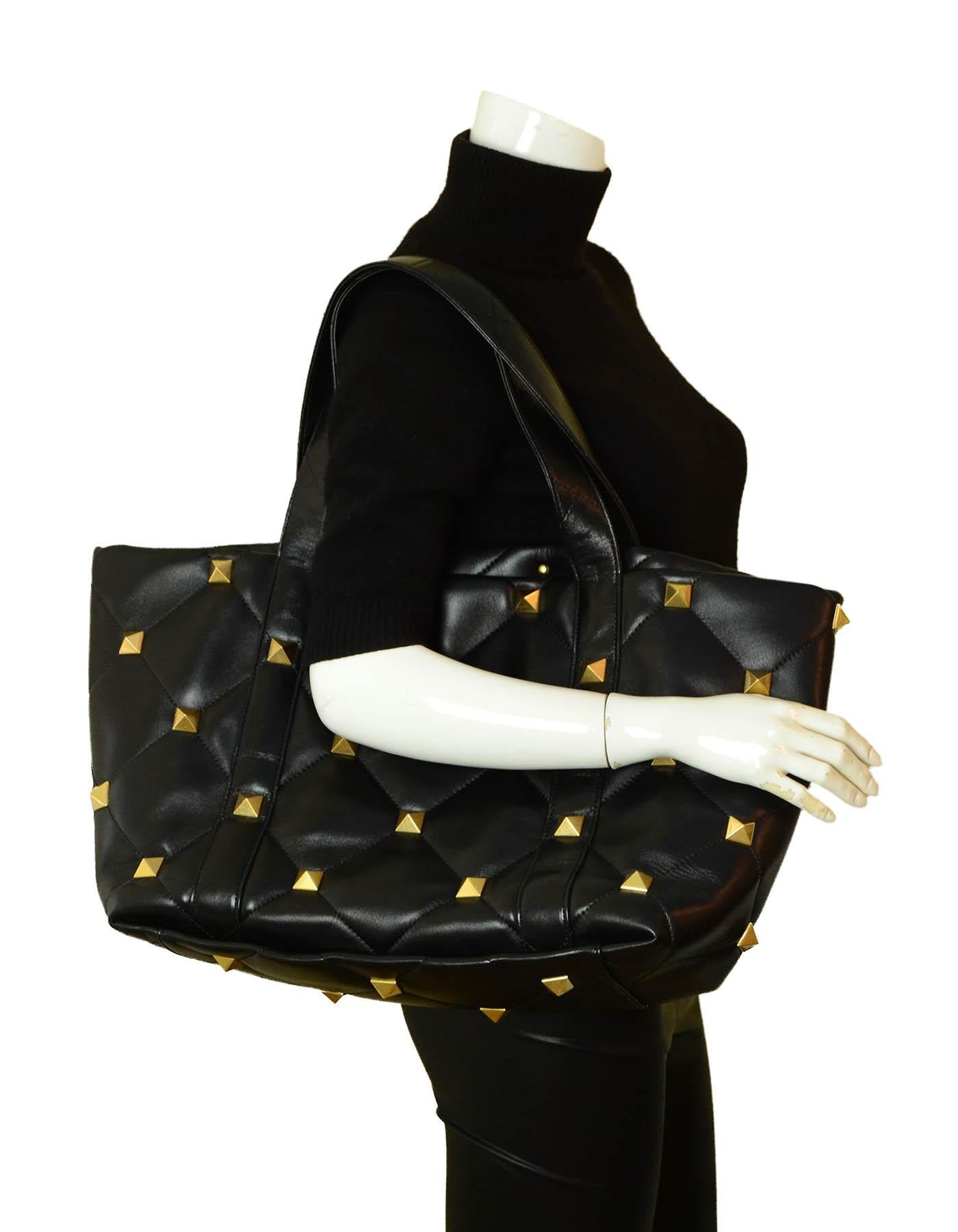 Valentino Garavani 2020 Roman Stud Quilted Leather Tote Bag

Made In: Italy
Year of Production: 2020
Color: Black
Hardware: Goldtone
Materials: Leather and metal
Lining: Smooth black leather
Closure/Opening: Open top
Exterior Pockets: N/A
Interior