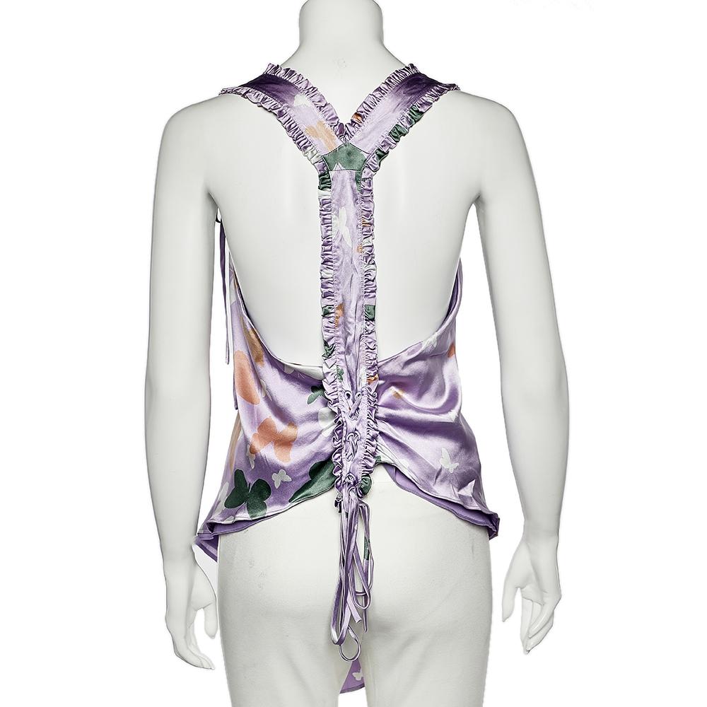 The Valentino camisole is known for its attention to detail and uncompromising quality. The use of purple color and butterfly prints in this creation makes it look stunning. Made from fine silk, this top is a crafty piece flawless for any season.

