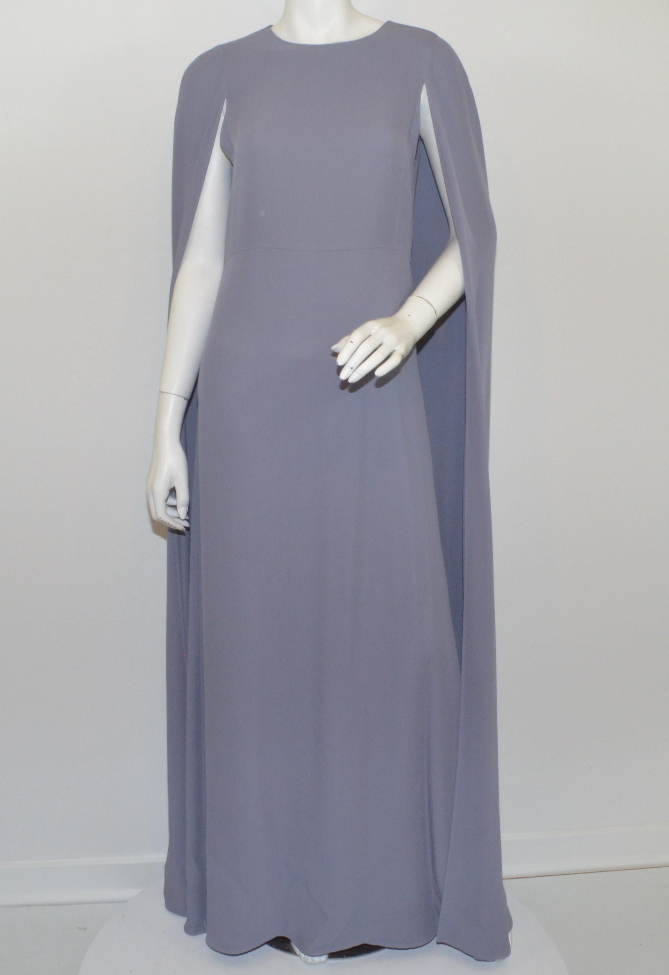 Valentino Cape Gown as seen on Jennifer Lopez, Kim Kardashian, Katy Perry-- Featured in a lilac color with a cape design and column gown. Dress has a back zipper fastening. Labeled size 8, made in Italy.

Measurements:
Bust 36”
Waist 32”
Hips