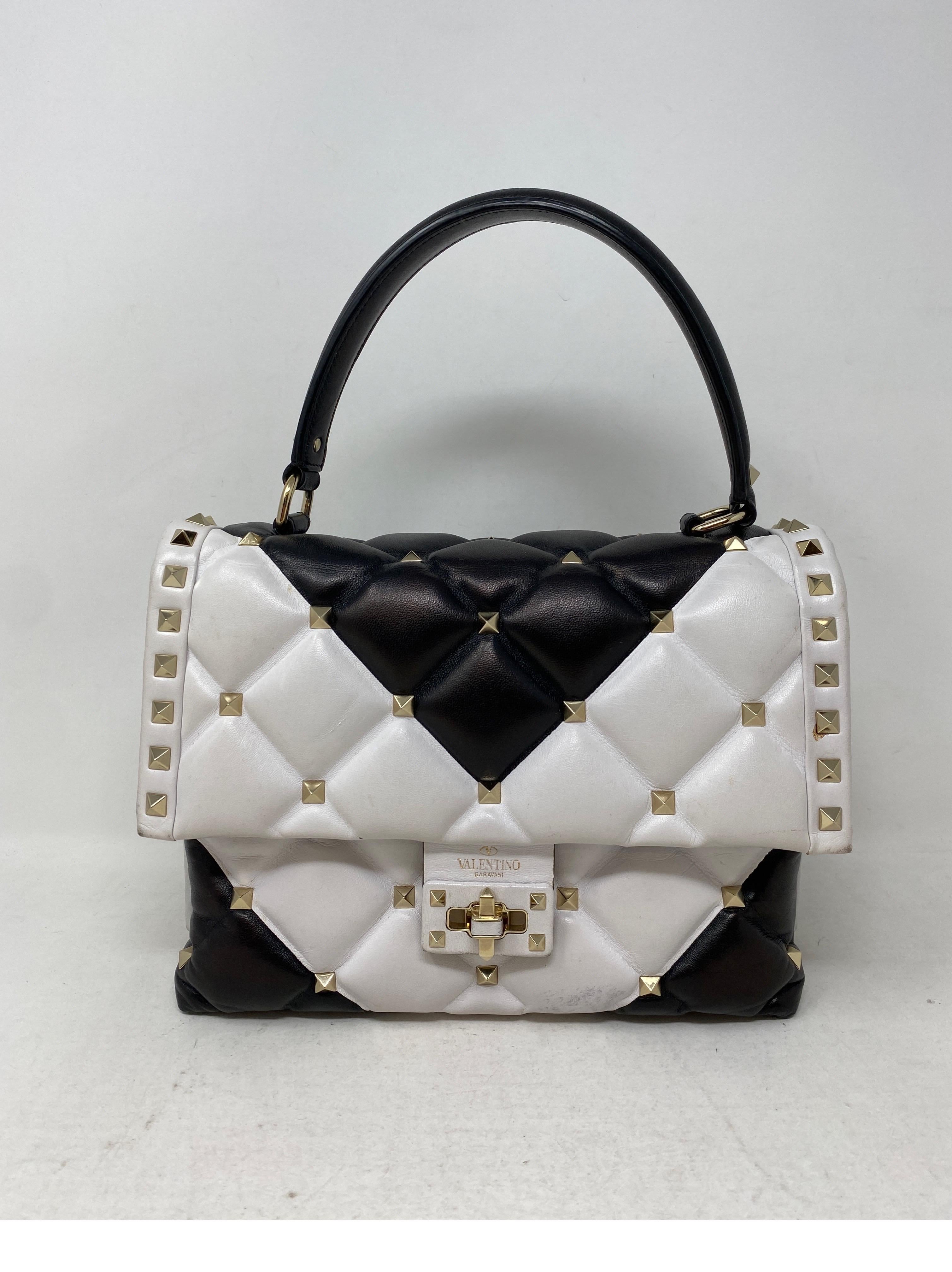 Valentino Limited Edition Studded Bag. Rare white and black leather bag. Some light wear on bottom of the bag. Very cool design. Has a strap that can be worn with or without. Clean interior. Guaranteed authentic. 