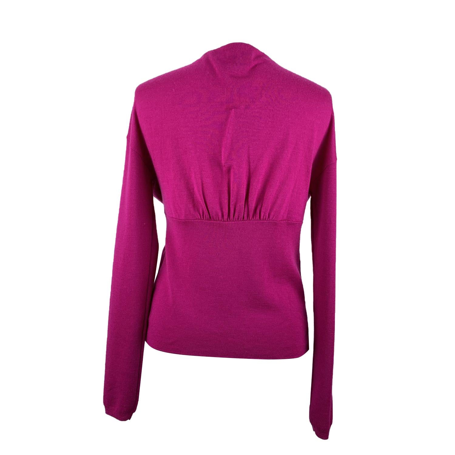 Valentino wool blend cardigan in magenta color. V - neckline, draping on the front and self-tie closure. Composition: 70% Wool Super 120 S, 20% Silk, 10% Cashmere. Size: M (The size shown for this item is the size indicated by the designer on the