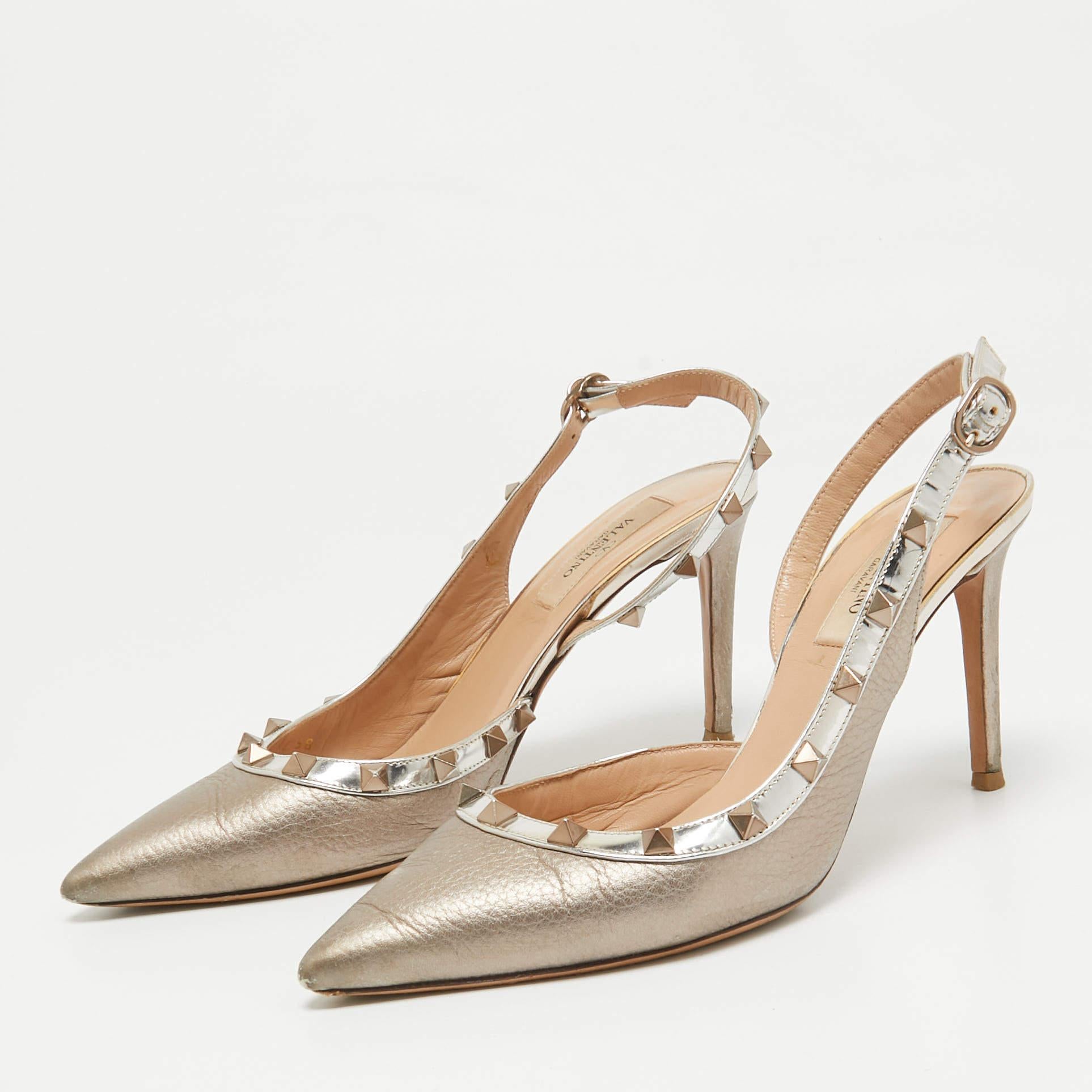 The addition of Rockstuds contributes to the instant brand identification of this pair of Valentino pumps. Constructed from patnet leather  they are elegantly lifted on 9.5cm heels  and multiple ankle buckle straps will fashionably bug your feet.