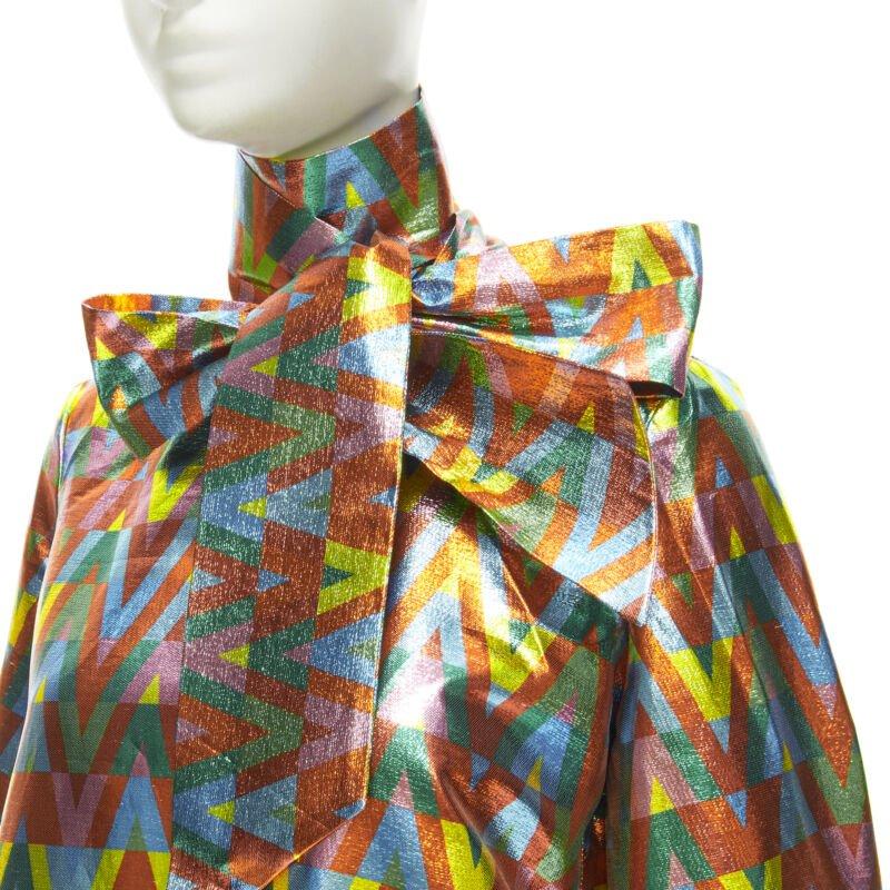VALENTINO metallic lurex graphic V rainbow scar tie collar blouse IT38 XS
Reference: AAWC/A00101
Brand: Valentino
Designer: Pier Paolo Piccioli
Material: Polyester, Metal
Color: Multicolour
Pattern: Chevron
Closure: Button
Lining:  Unlined
Extra