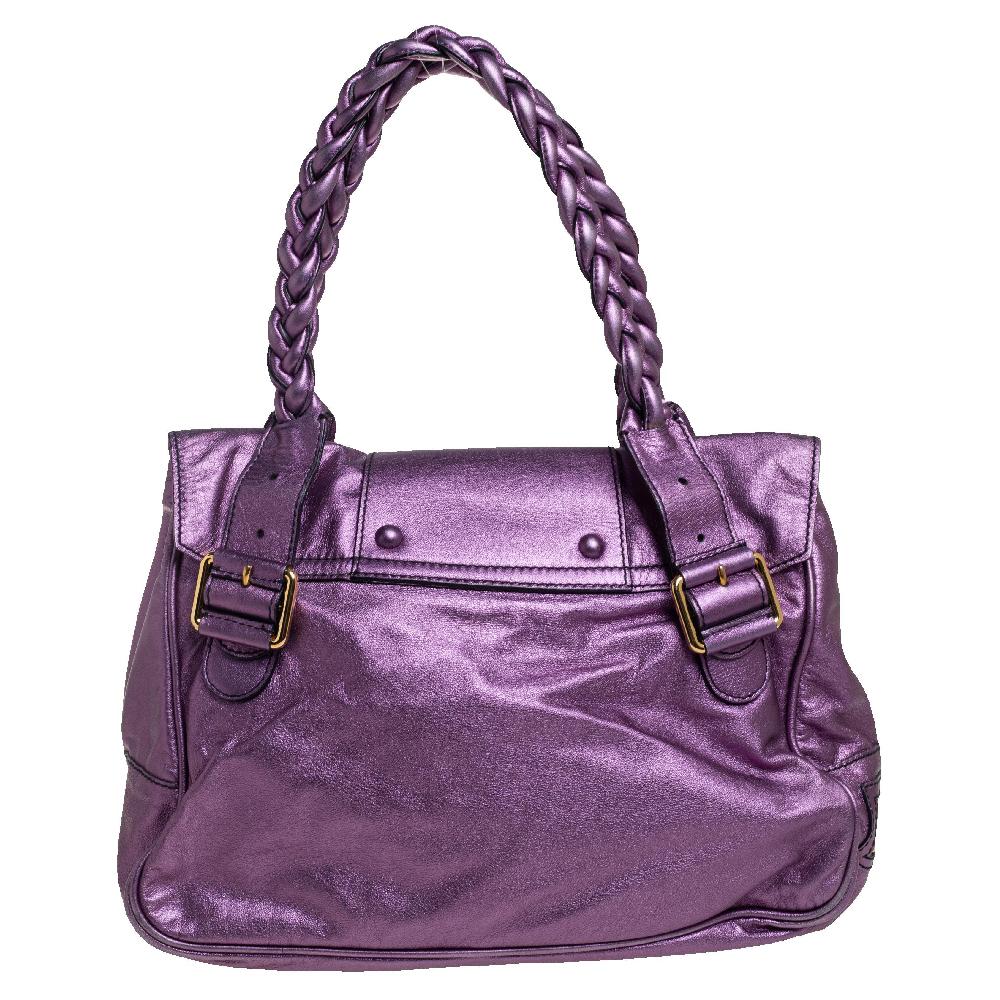 Valentino's Histoire satchel is defined by braided trims and handles. It is a functional bag meant to elevate your style and ease your day. This metallic purple version is crafted in leather and lined with fabric. The bag has front pockets and a