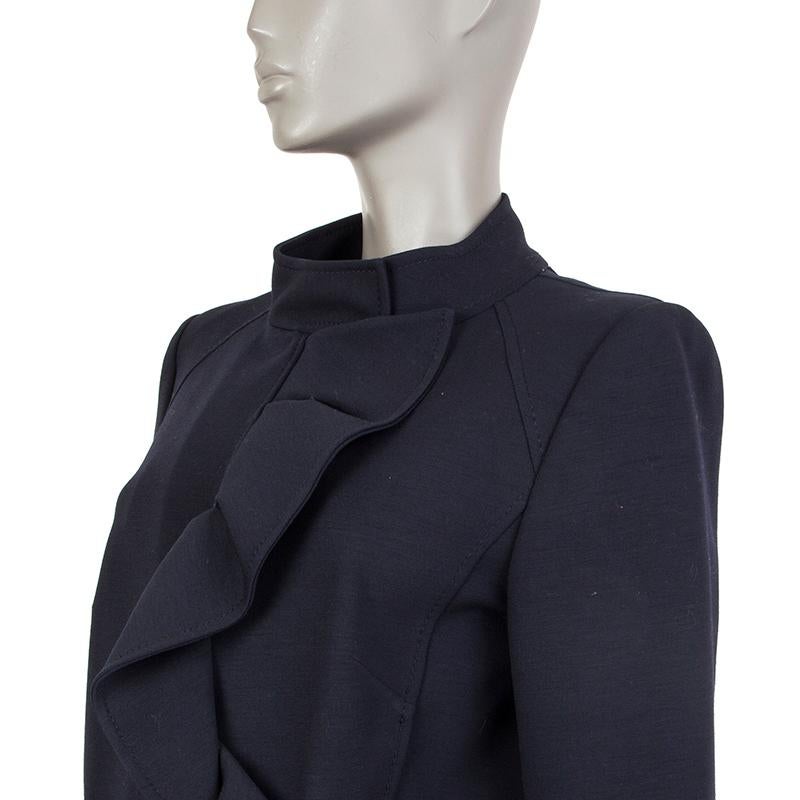 100% authentic Valentino jacket in midnight blue wool blend (assumed as tag is missing). With band collar, ruffled front, two slit pockets on the front, and zipper cuffs, Closes with concealed snaps on the neck and two-way zipper on the front.