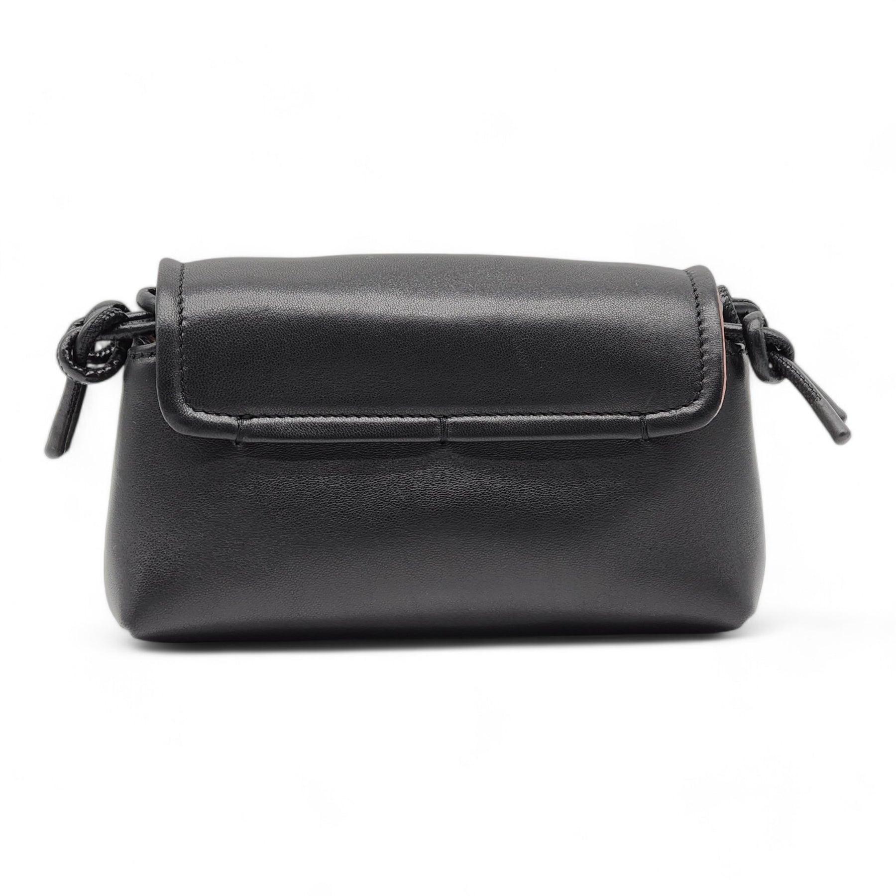 VLOGO hardware details the curved flap of an elongated shoulder bag crafted from lambskin leather in a softly structured silhouette.

Additional information:
Material: Leather
Magnetic-snap flap closure
Interior wall pocket
Lined
Color: