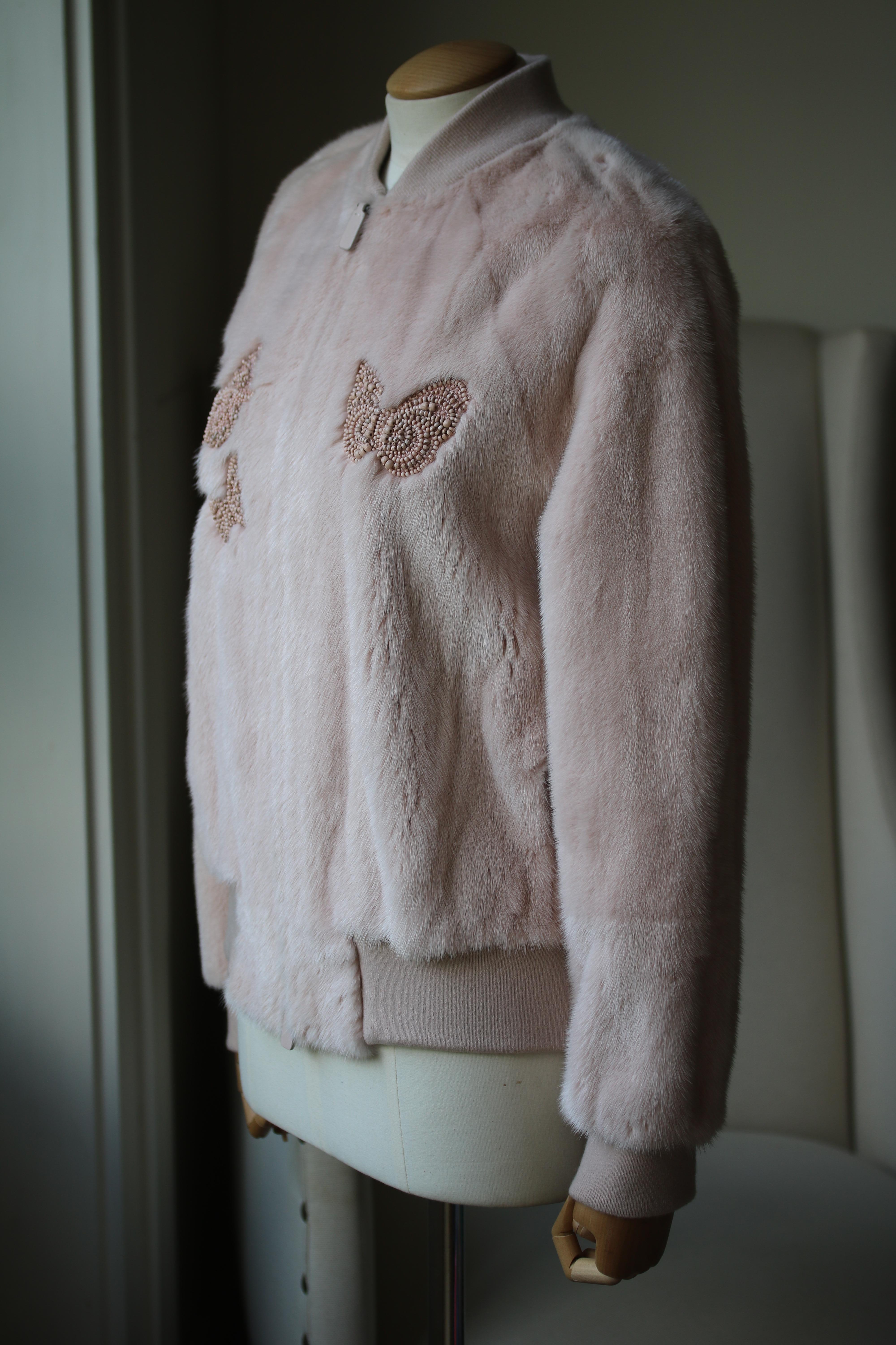 Valentino's bomber jacket is crafted of pink luxurious mink fur. Made in Italy, this style is embellished with multicoloured intricate beading in this season's iconic butterfly motif. Rib-knit stand shawl collar, cuffs, bottom band. Long sleeves.