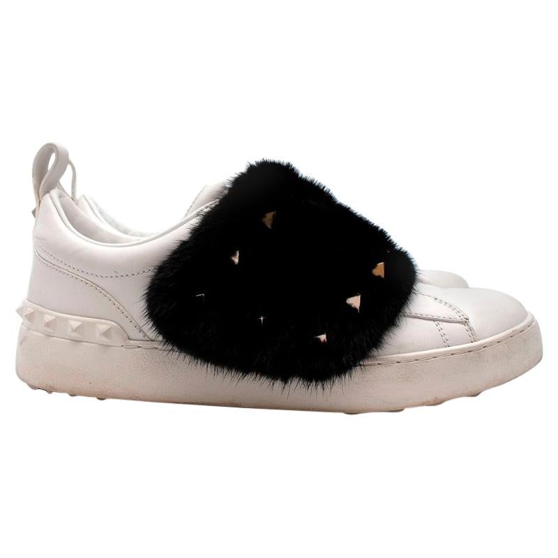 Valentino White Sneakers with Fur and Rockstud Detail

- fur and stud sneakers feature a round toe
- platinum-finish studs
- rubber sole with stud detailing at back

Materials 
Sole: Rubber 100%

Outer: Calf Leather 100%, Viscose 39%, Polyester 37%,