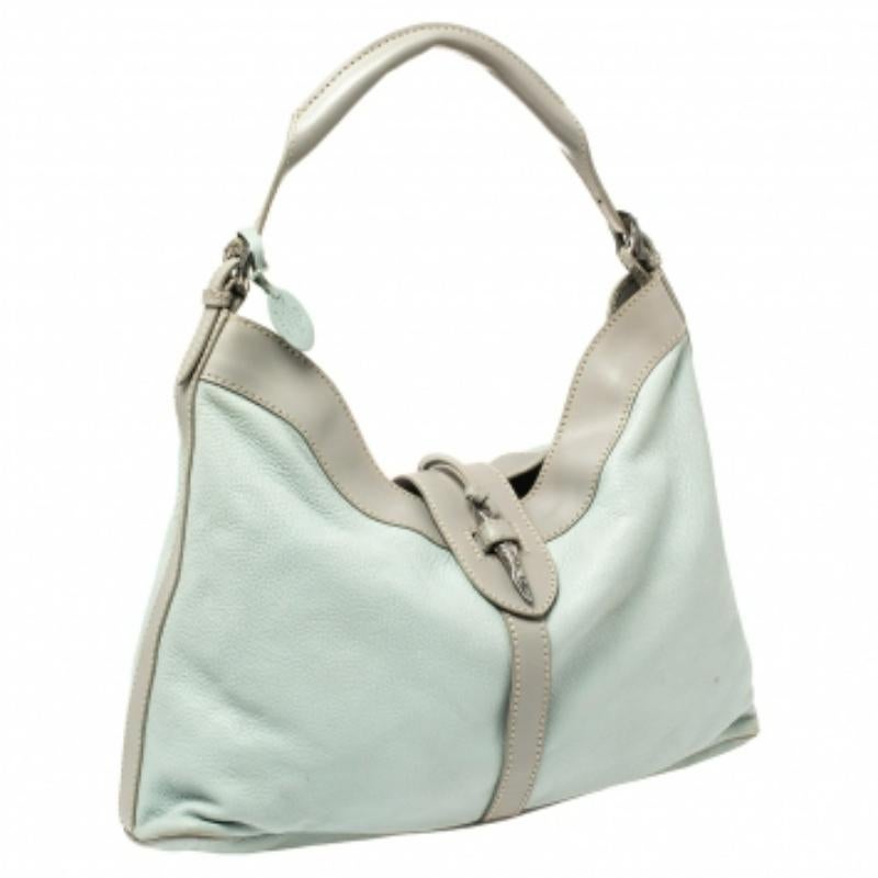 Minimal aesthetics, maximum appeal. This Valentino hobo is crafted in mint blue and grey leather, secured by a silver-tone metal motif, and lined with satin. Held by a single handle, the hobo is ideal for everyday use.