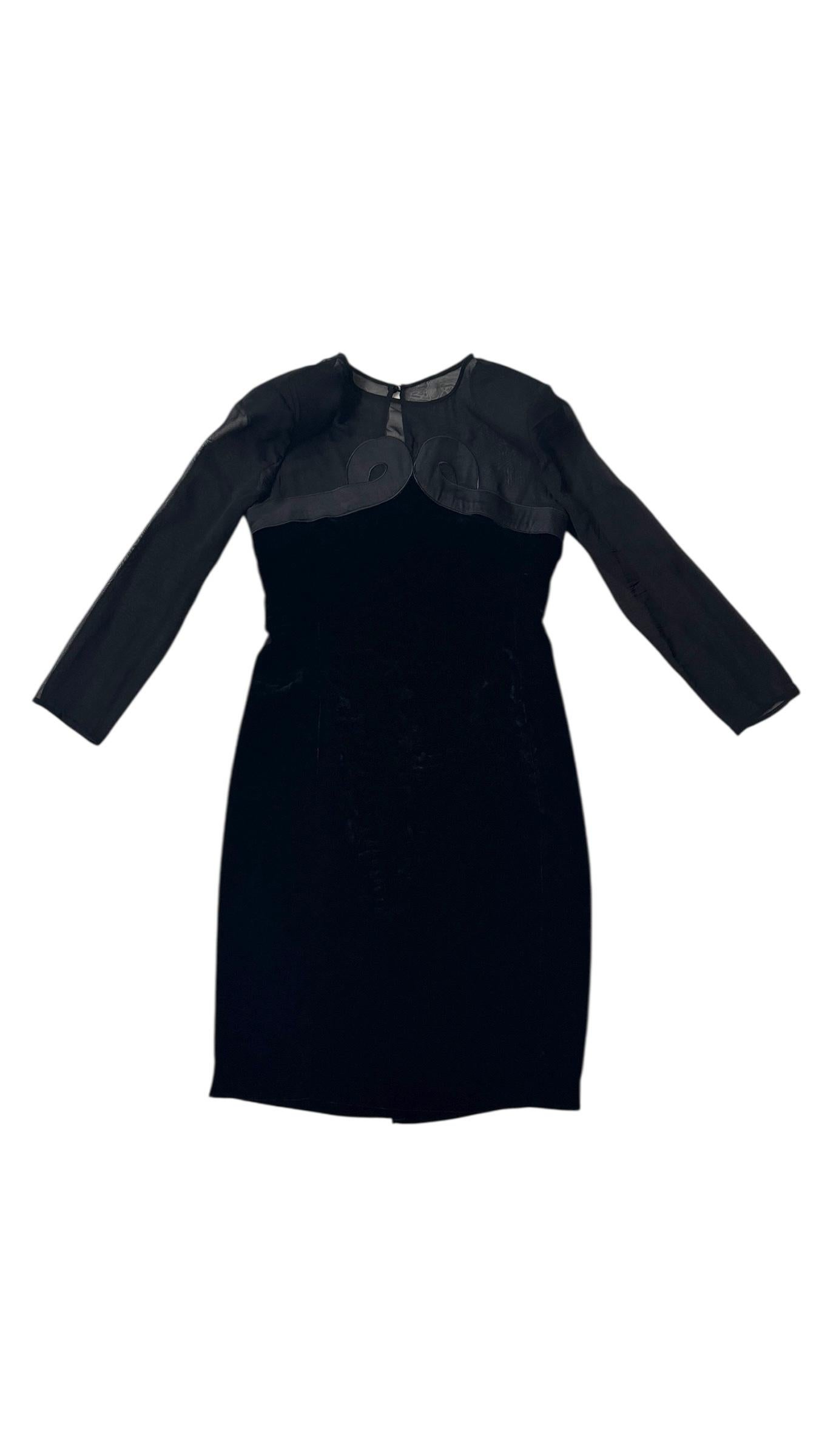Refined and architectural, this vintage Valentino cocktail dress blends sensuality and structure in a timeless silhouette. Dating from the late 1980s to early 1990s, the piece features a sculpted body in deep black velvet, contrasted by sheer silk