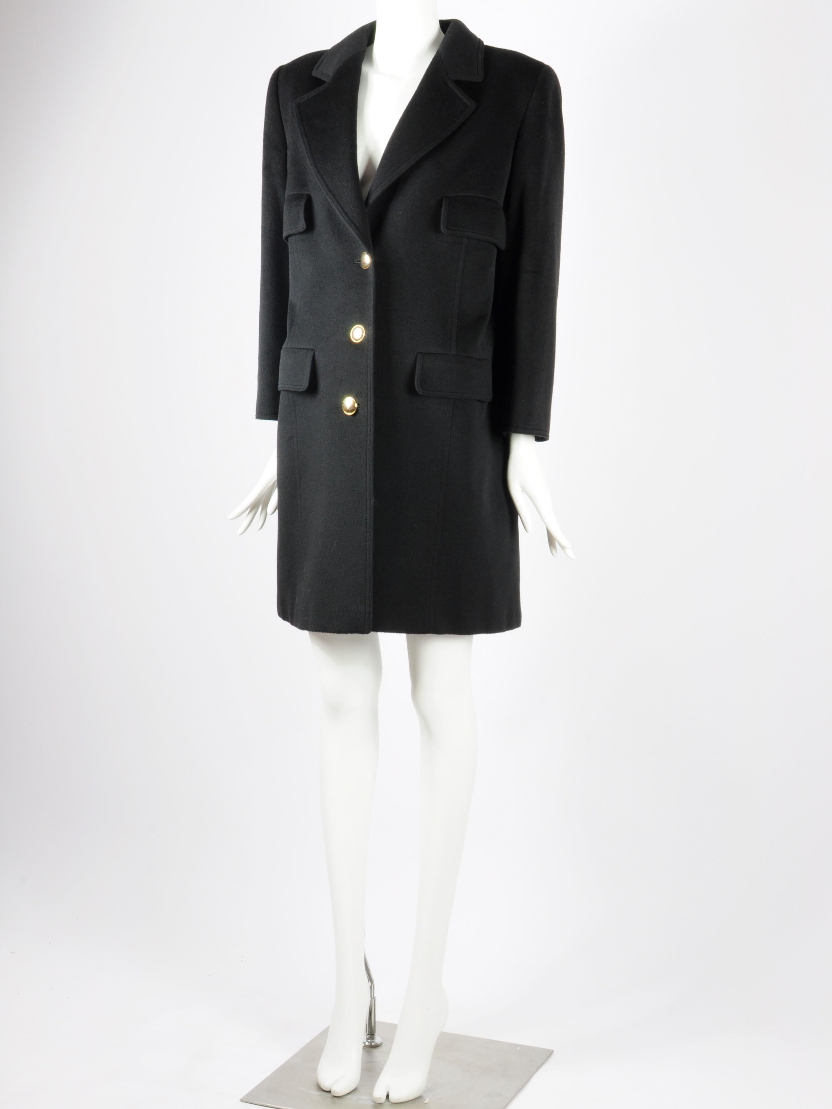 Valentino Miss V 1990s black coat in wool and cashmere with golden buttons. A single breasted cashmere Valentino coat with gold coloured buttons. It features very feminine tailoring, soft cashmere/wool blend fabric and four (faux) pockets on the
