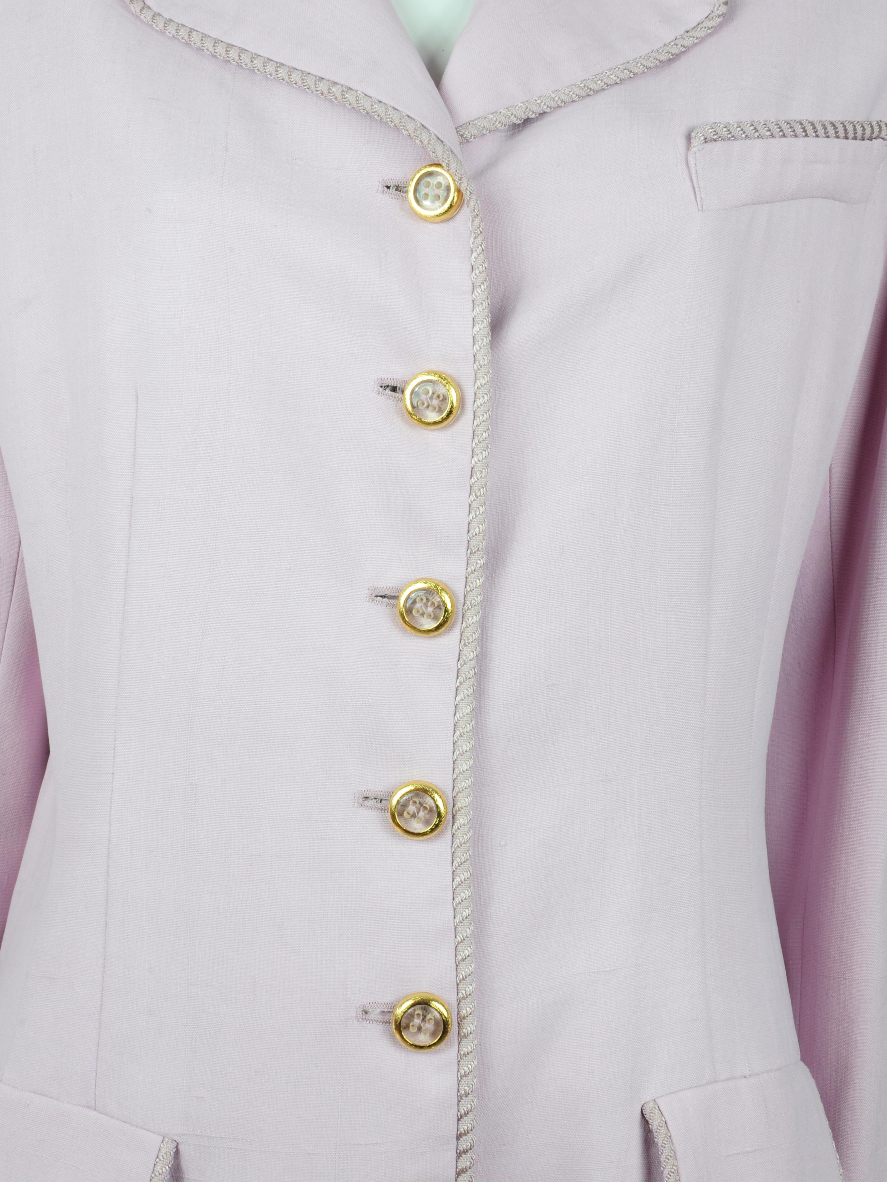 A silk vintage Valentino blazer jacket - the epitome of chic – with gorgeous golden buttons and piping details on the collar, sleeves and pockets. The tailoring is exquisite (as Valentino suiting most often is) and will hug a curvy shape whilst