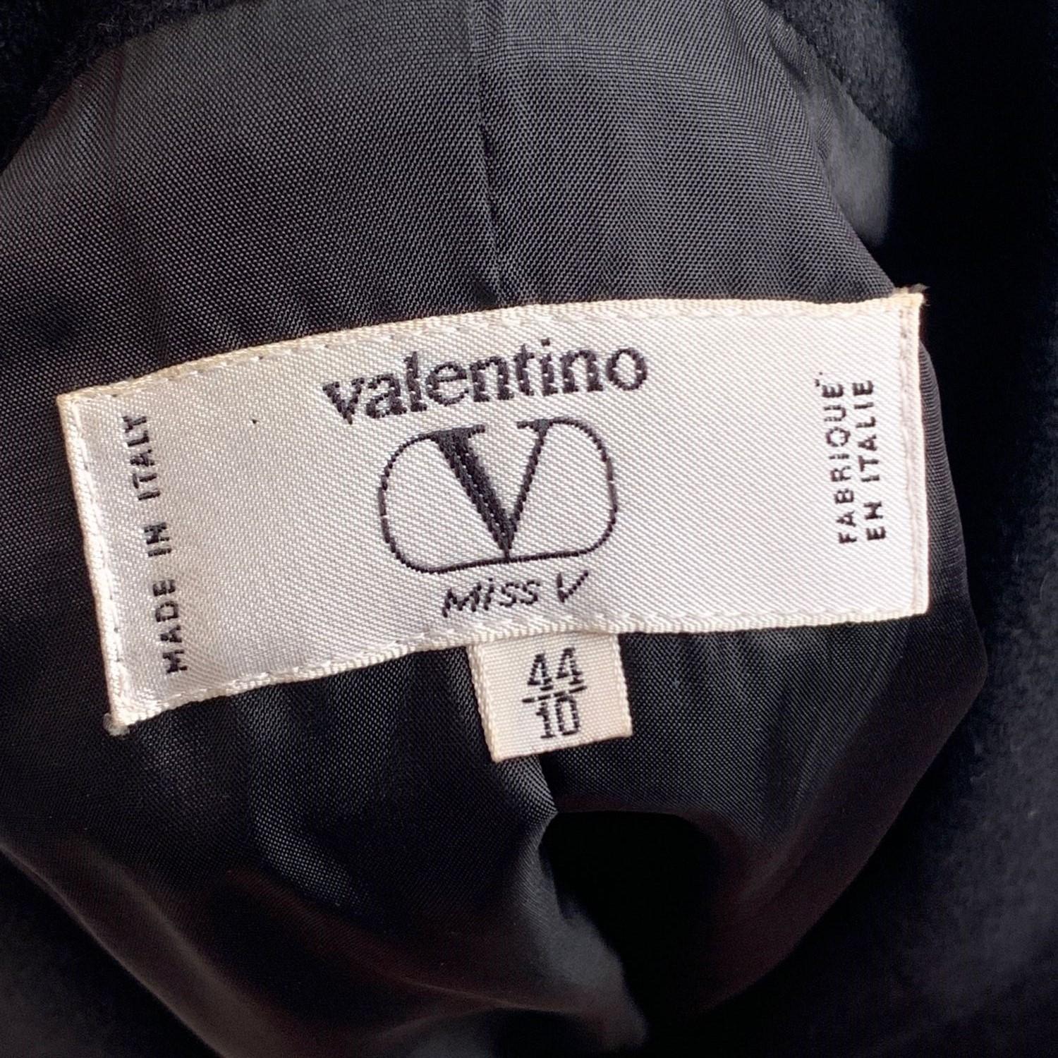 Vintage Valentino Miss V black double-breasted blazer crafted of Loro Piana pure cashmere fabric. Button closure on the front. Long sleeve styling with buttoned cuffs. Composition: 100% cashmere. Lined. 2 pockets on the waist. Size: 44 IT (it should