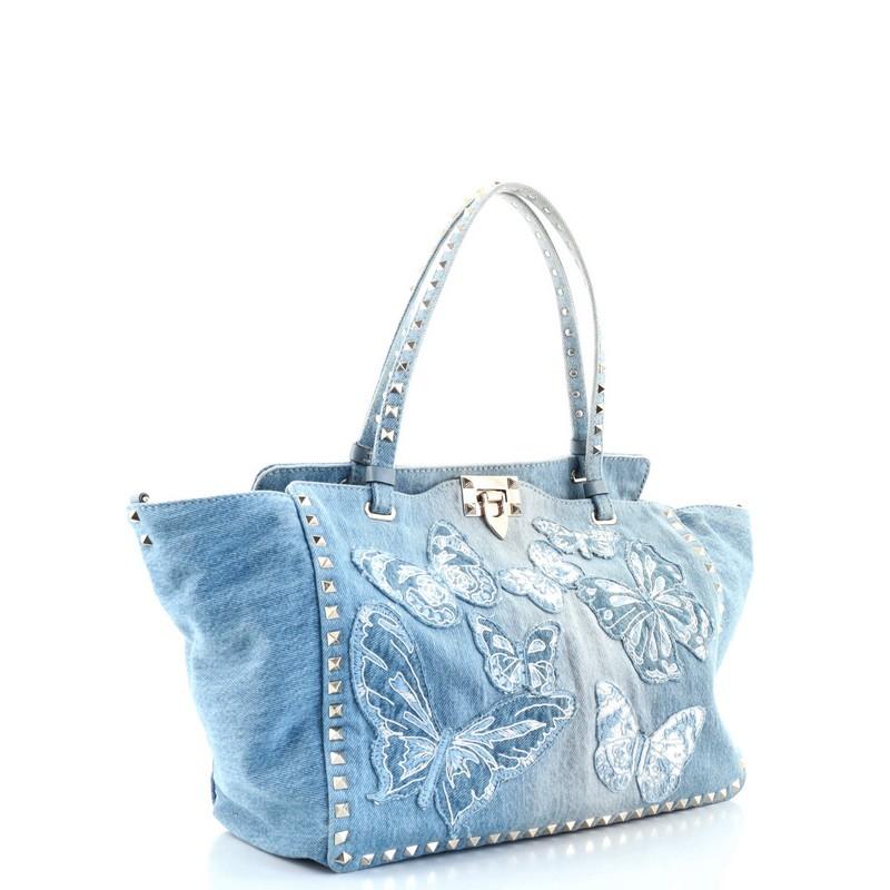 Condition: Fair. Heavy wear and discoloration on base corners, opening edges, handles and strap, creasing and stains on exterior. Fraying on front appliques, wear, discoloration and stains in interior, scratches on hardware.
Accessories: With
