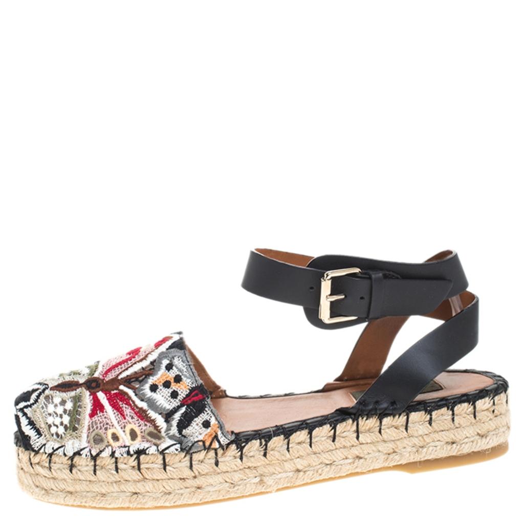 Step out in style with these pretty espadrilles from Valentino. Featuring a leather and lace exterior, this trendy pair is styled with butterfly embroidery on the uppers and braided platforms. These sandals are complete with ankle straps and