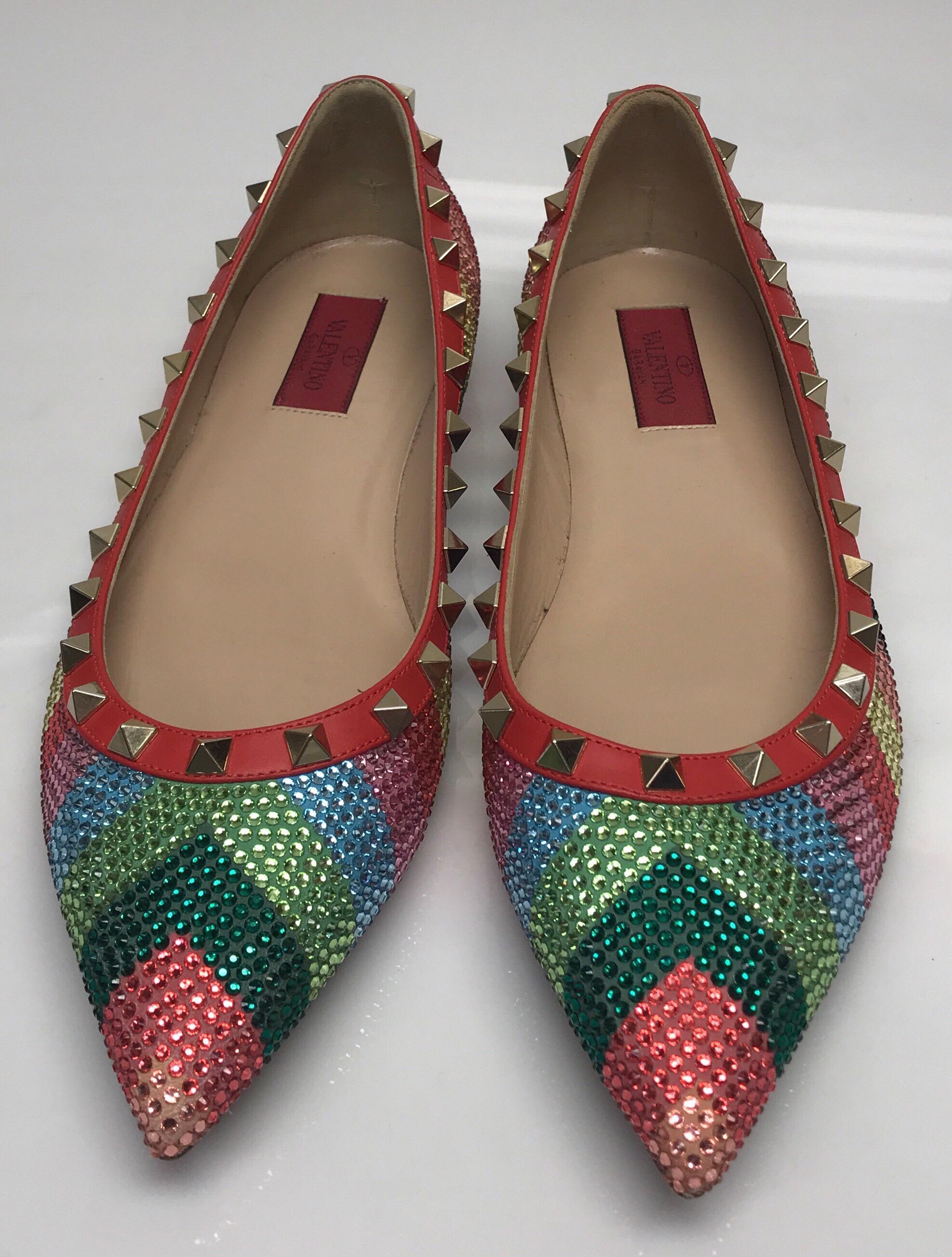 Valentino Multi color iridescent flats w/ studs-39. These amazing Valentino flats are in excellent condition. They show minimal signs of use. They have a multi colored chevron pattern with iridescent rhinestones throughout. There is a red leather