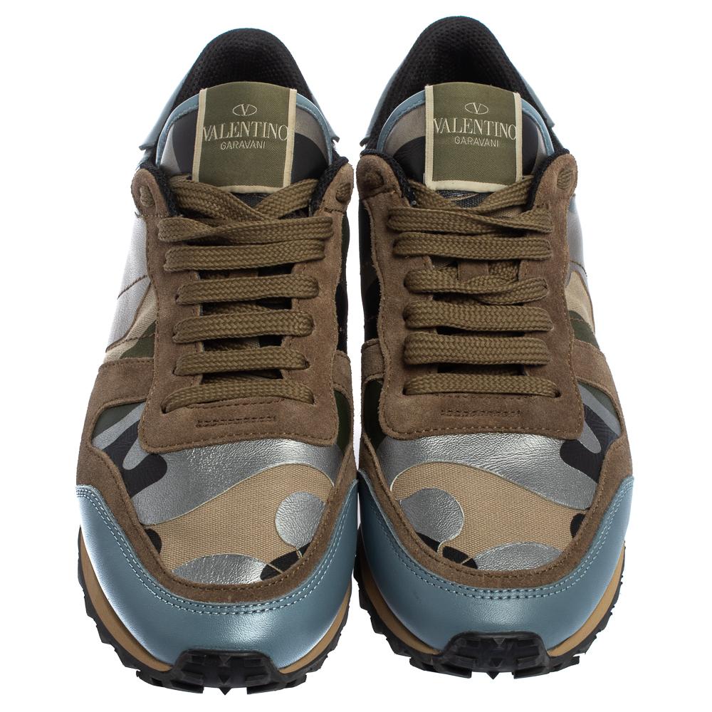 Ride your days away in high comfort with these camouflage Rockrunner sneakers from Valentino! They've been wonderfully crafted from a combination of leather, canvas, and suede and designed with the signature pyramid studs on the counters, laces on