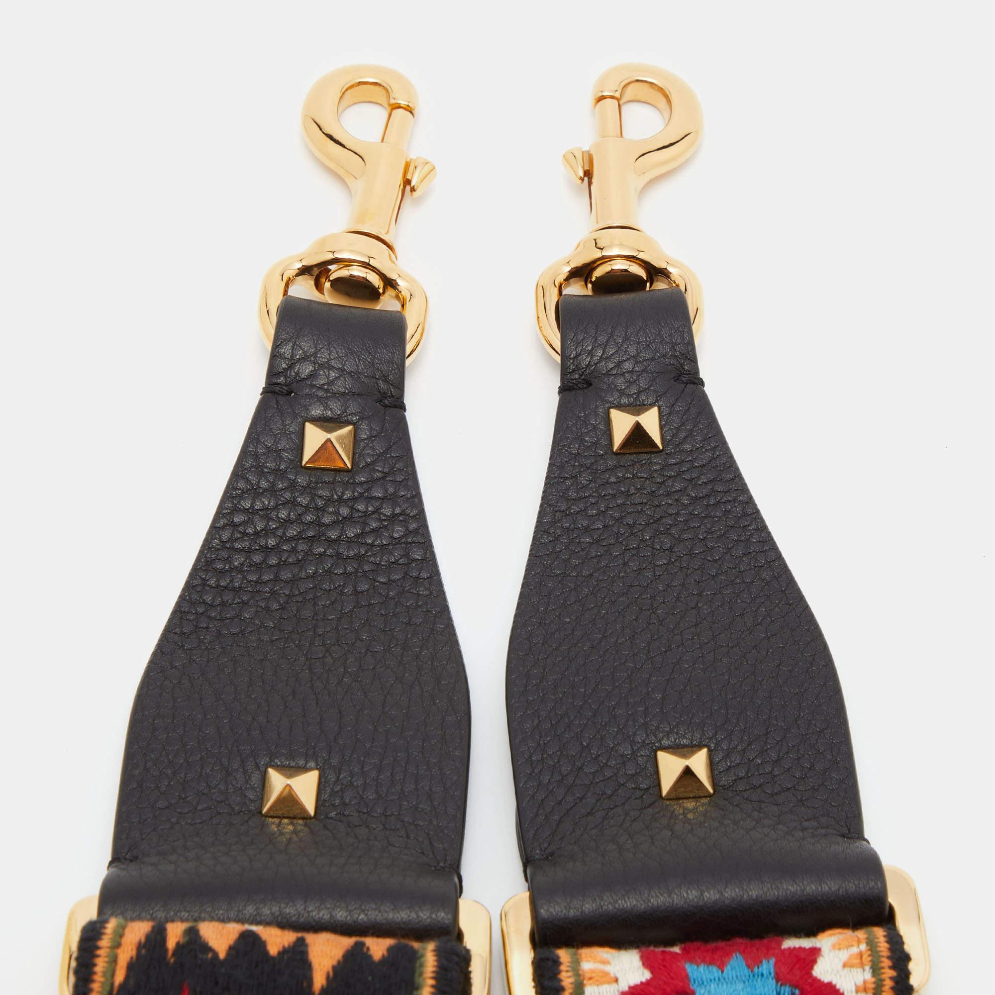 Words fall short in describing this exquisite guitar strap from Valentino! Crafted with love from canvas with intricate patterns. The piece is adjustable, and it has two clasps for you to attach to your bags.

Includes: Brand Tag