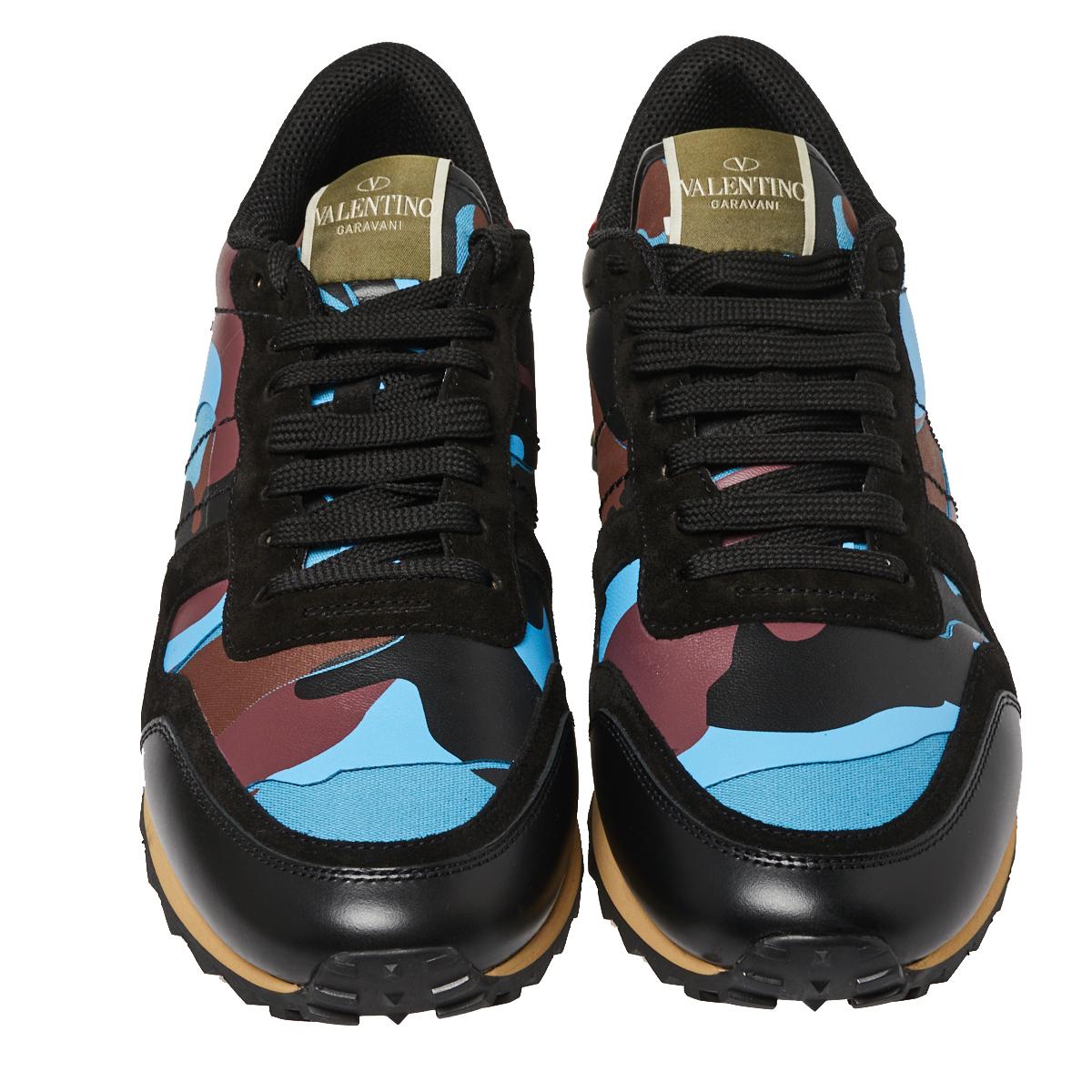 These multicolor Rockrunner sneakers from Valentino are made for the ones who want to stand out. Crafted from fine fabric and leather, these come in a camouflage design with laces on the vamps. They have Rockstud detailing on the counters and tough