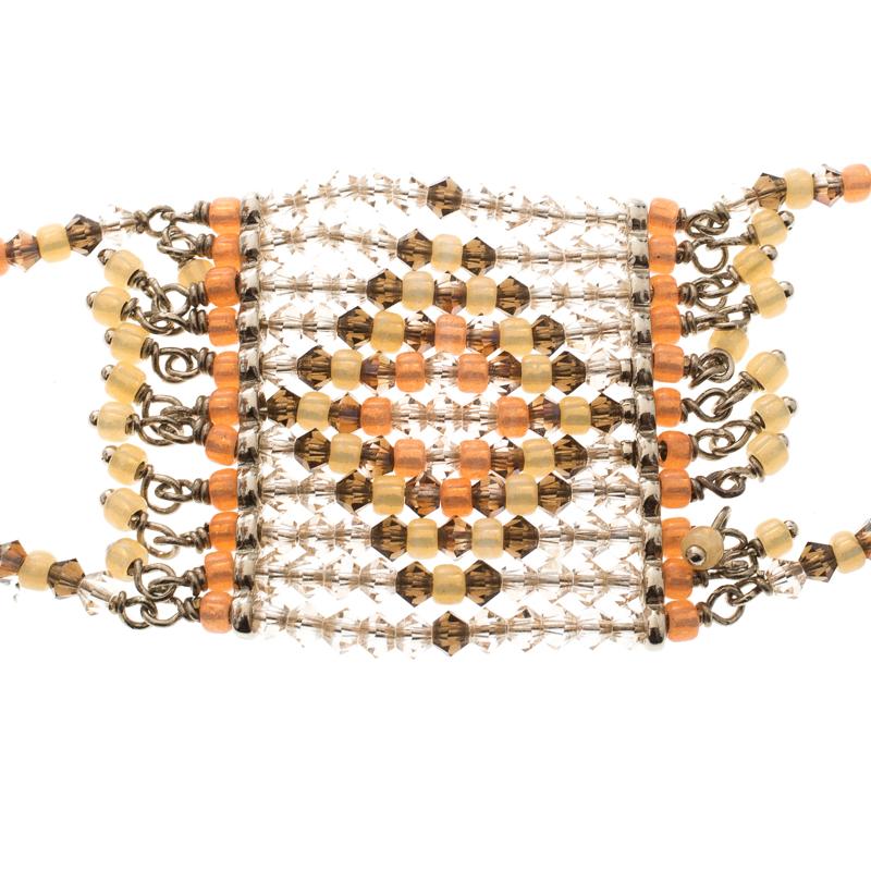 This beauty from Valentino is exquisite and perfectly designed to impress! Beautifully crafted from gold-tone metal, this piece is a stunner. It has been styled with crystals and beads while being held by a lobster clasp. This minimal creation is