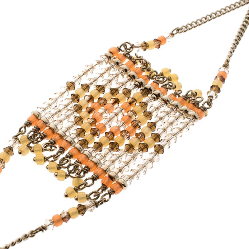 This beauty from Valentino is exquisite and perfectly designed to impress! Beautifully crafted from gold-tone metal, this piece is a stunner. It has been styled with crystals and beads while being secured by a lobster clasp. This minimal creation is