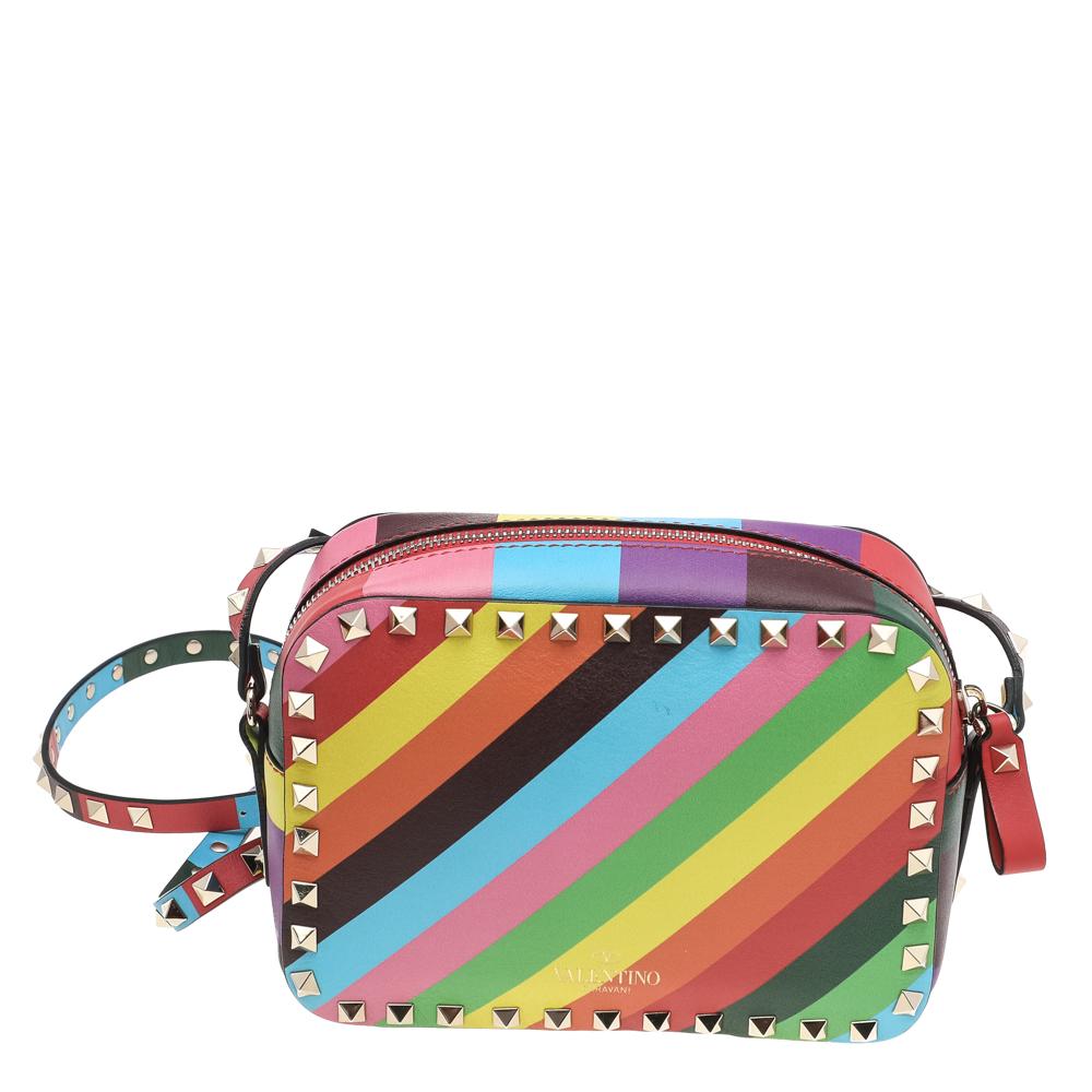 Trust this Valentino 1973 Rainbow Rockstud bag to be light, durable, and comfortable to carry. Crafted from leather, it has multiple colors, Rockstud trims, and a lined interior. The long strap allows shoulder and crossbody wear.

Includes: Original
