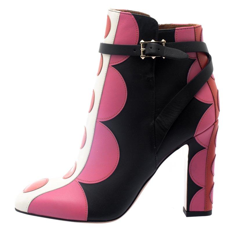 Flaunt the best-looking boots with this vibrant creation from Valentino. Crafted from leather, they carry a playful polka dot exterior and comfy insoles with the brand's label. The pair is balanced by block heels and completed with signature